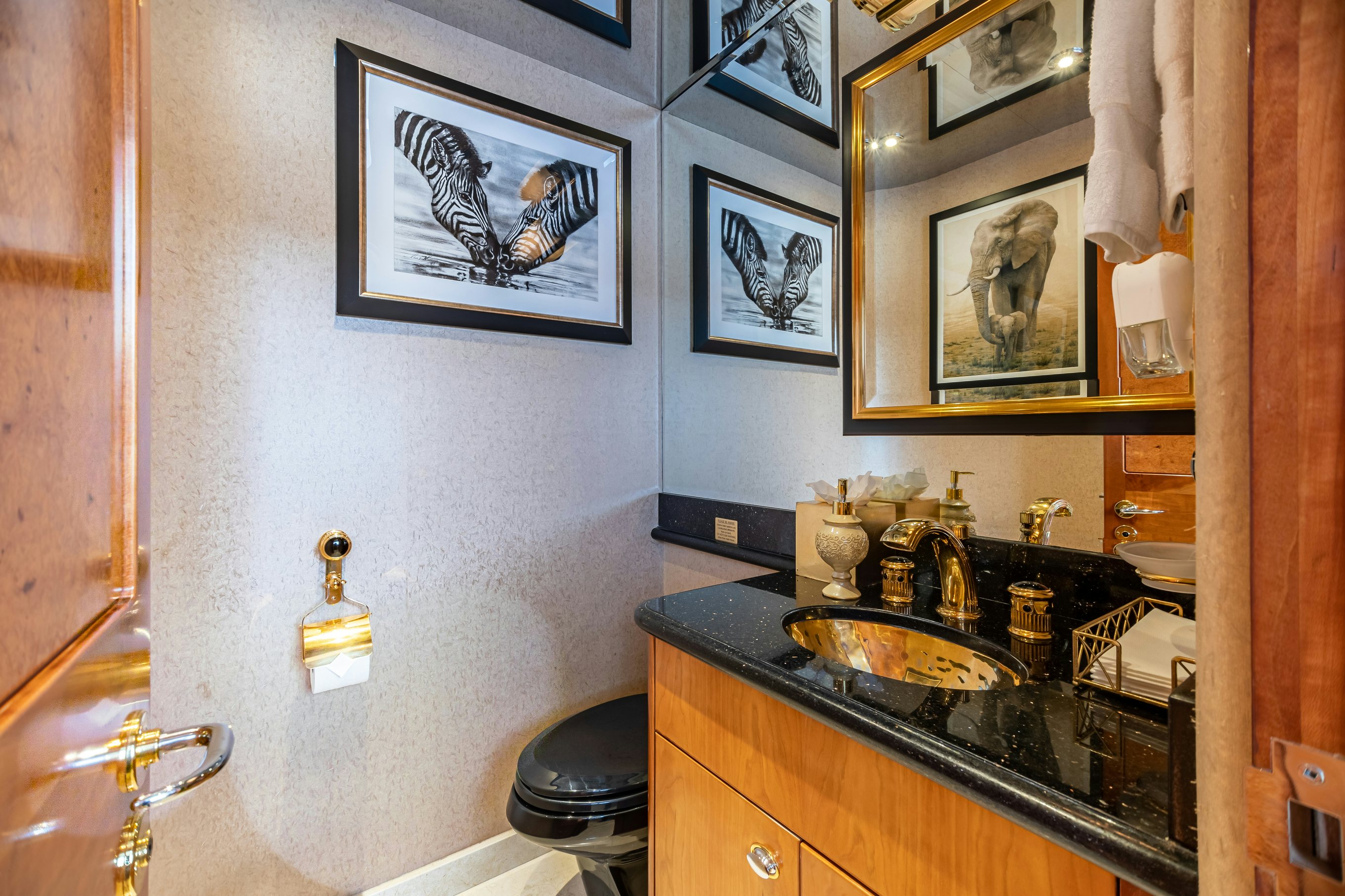 a bathroom with a sink and a mirror aboard SERENGETI Yacht for Charter