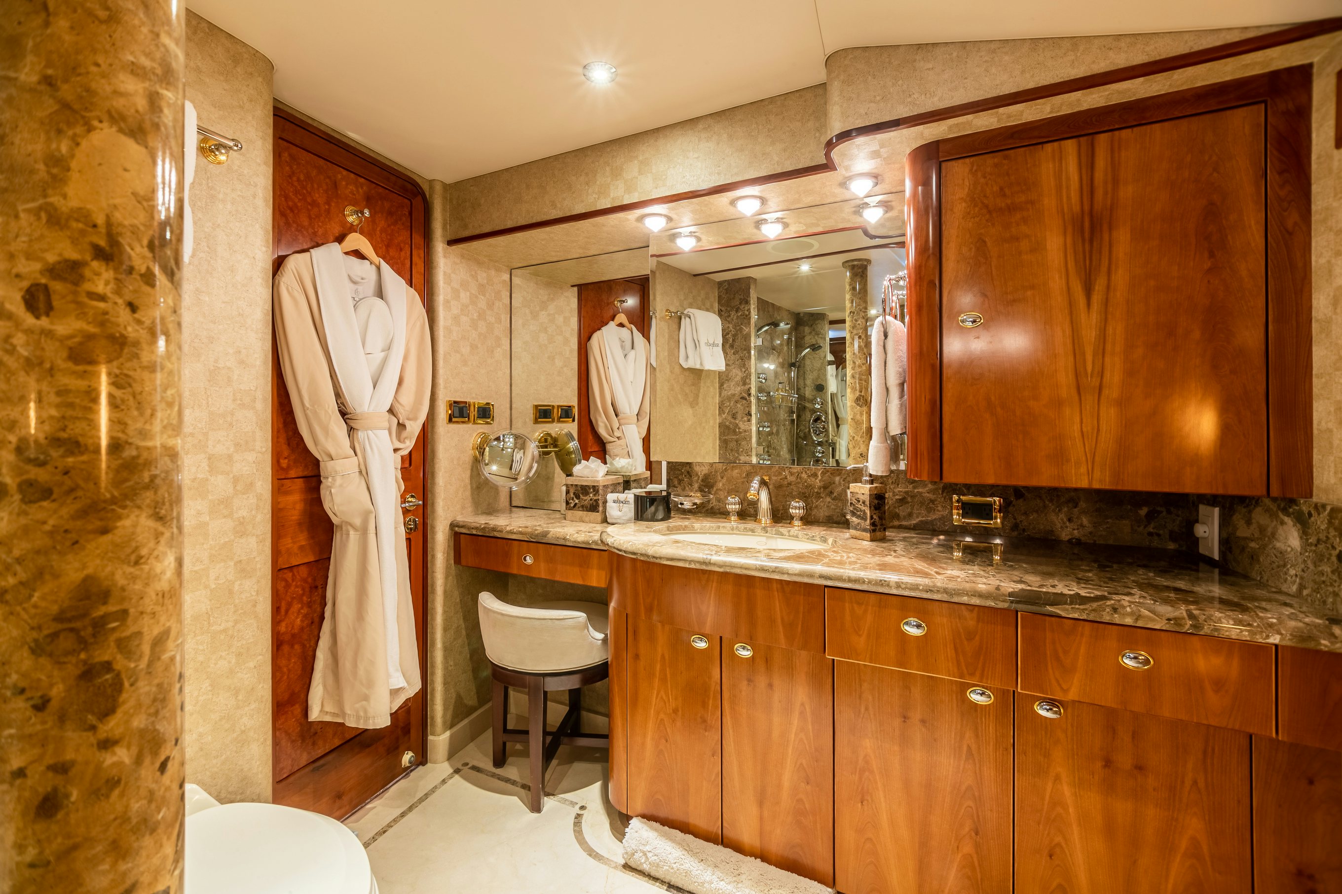 a bathroom with a sink and a mirror aboard SERENGETI Yacht for Charter