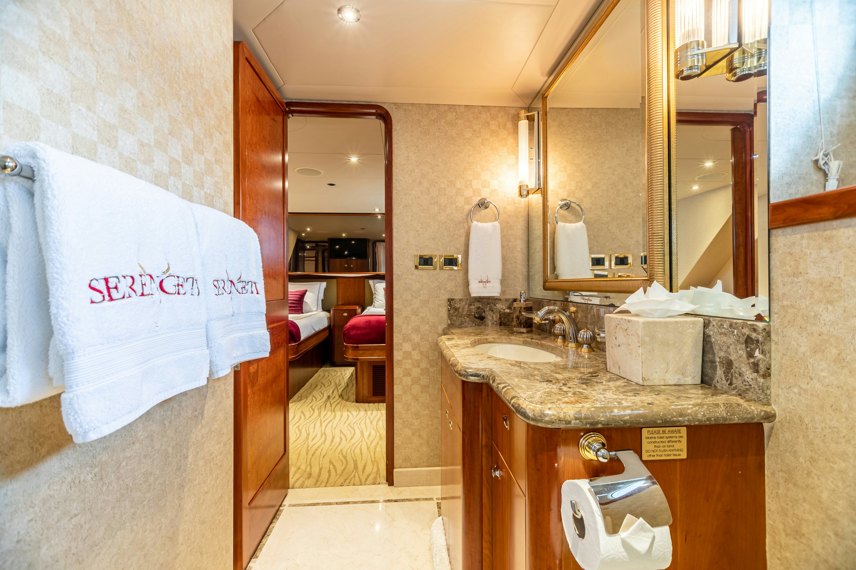 a bathroom with a sink and a mirror aboard SERENGETI Yacht for Charter