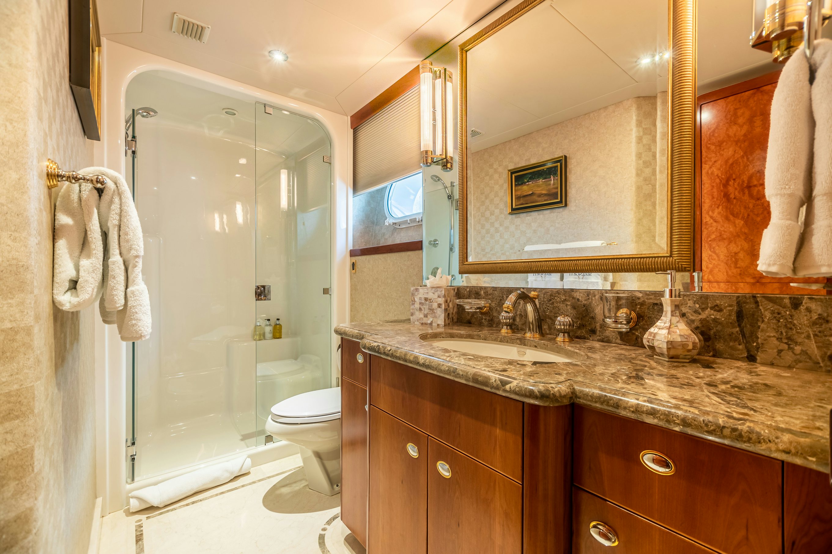 a bathroom with a glass shower aboard SERENGETI Yacht for Charter