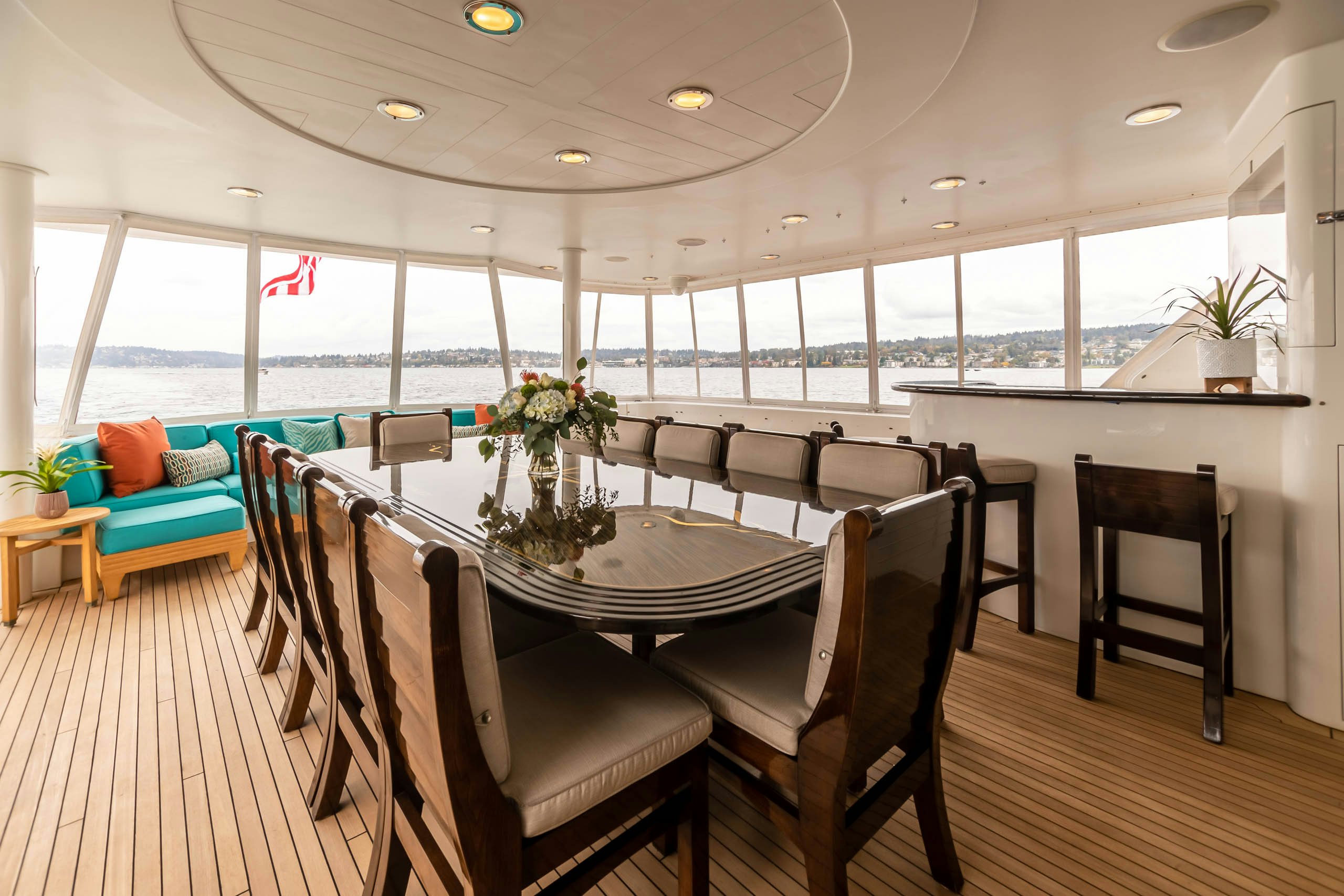 a large room with a table and chairs aboard SERENGETI Yacht for Charter
