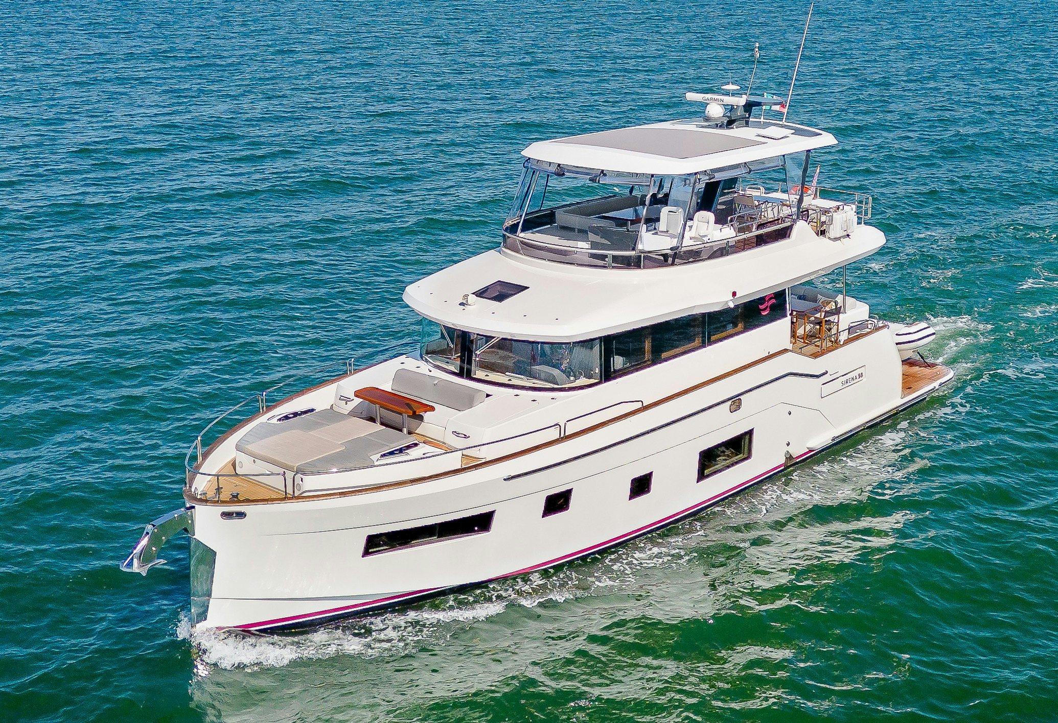 a white boat in the water aboard VIAKAREY Yacht for Sale
