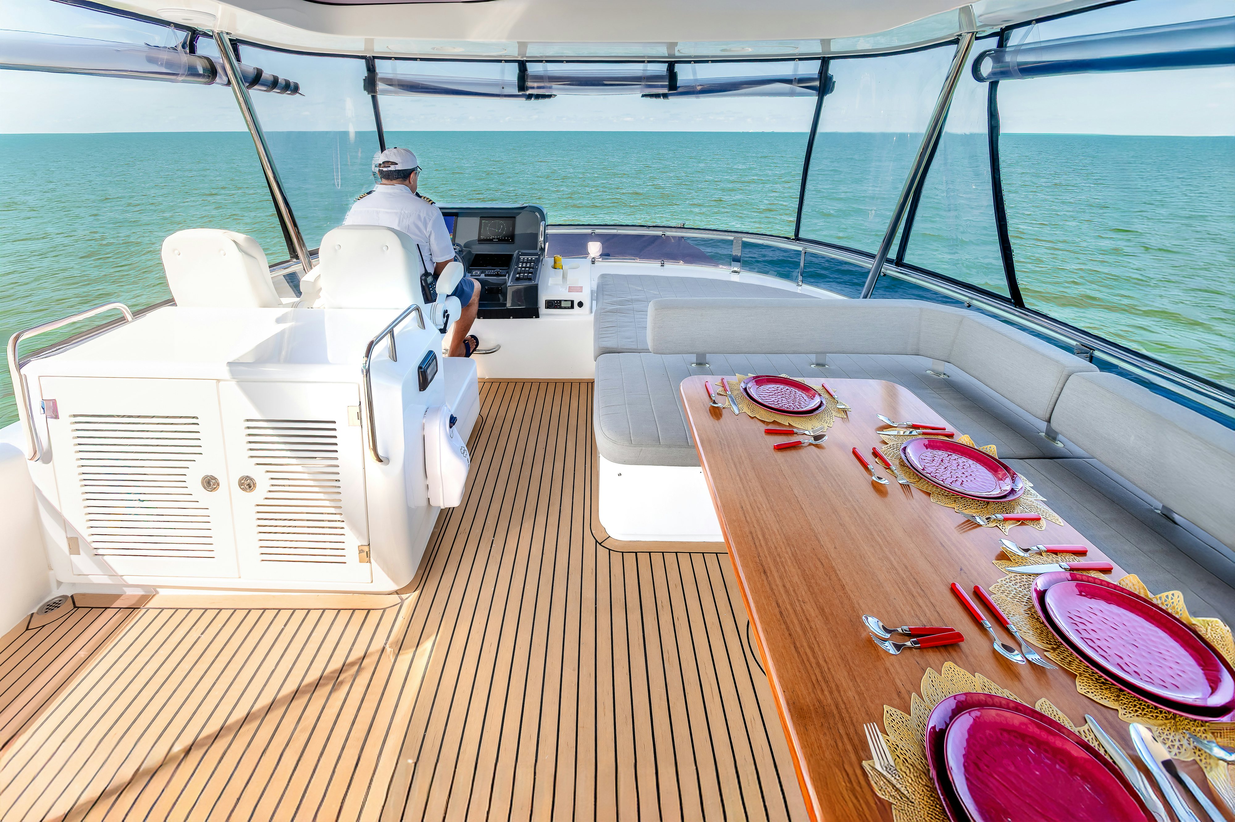 a person sitting on a boat aboard VIAKAREY Yacht for Sale