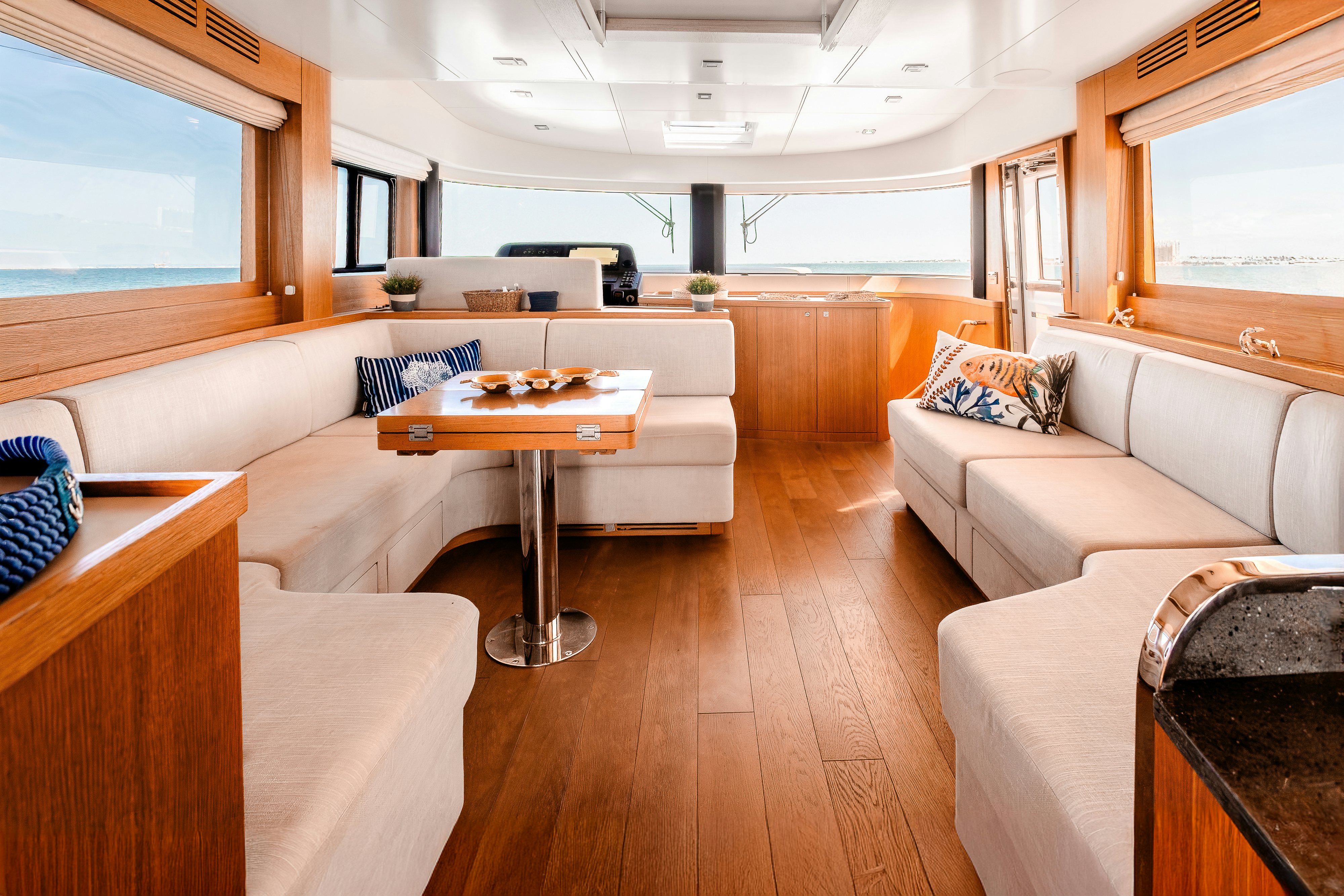 a living room with a couch and a table aboard VIAKAREY Yacht for Sale