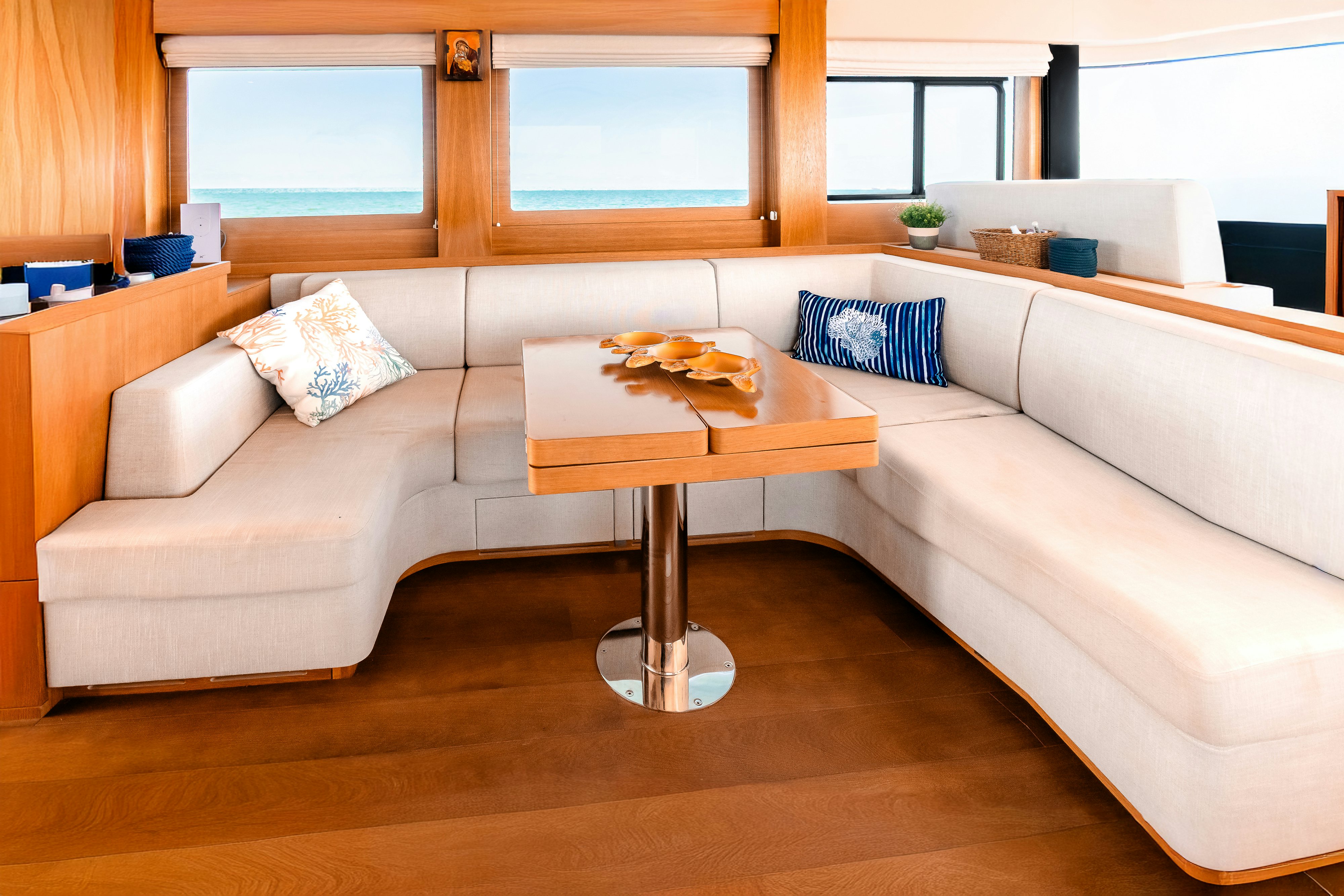 a couch and coffee table in a room aboard VIAKAREY Yacht for Sale