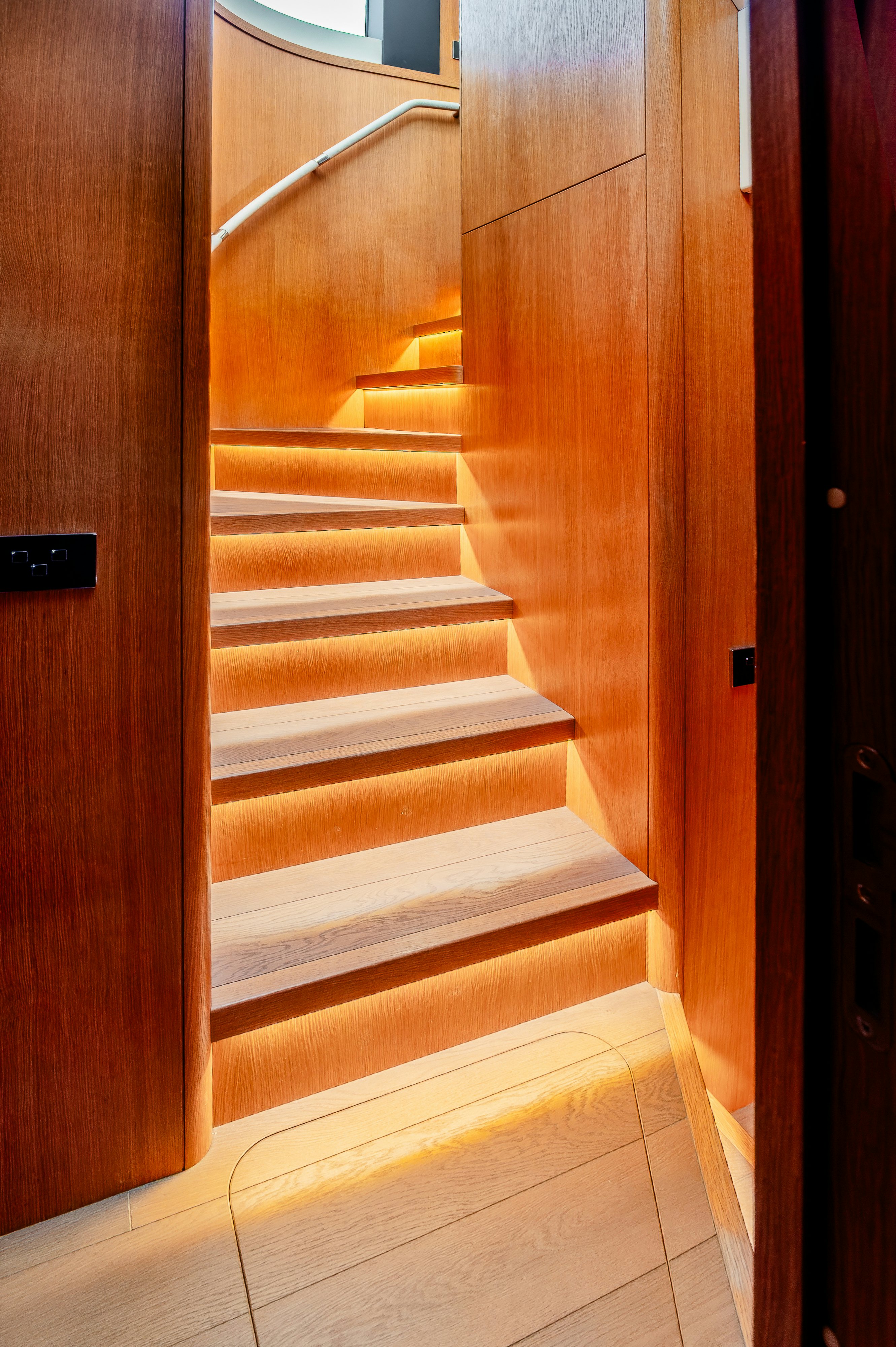 a wooden door with a white railing aboard VIAKAREY Yacht for Sale