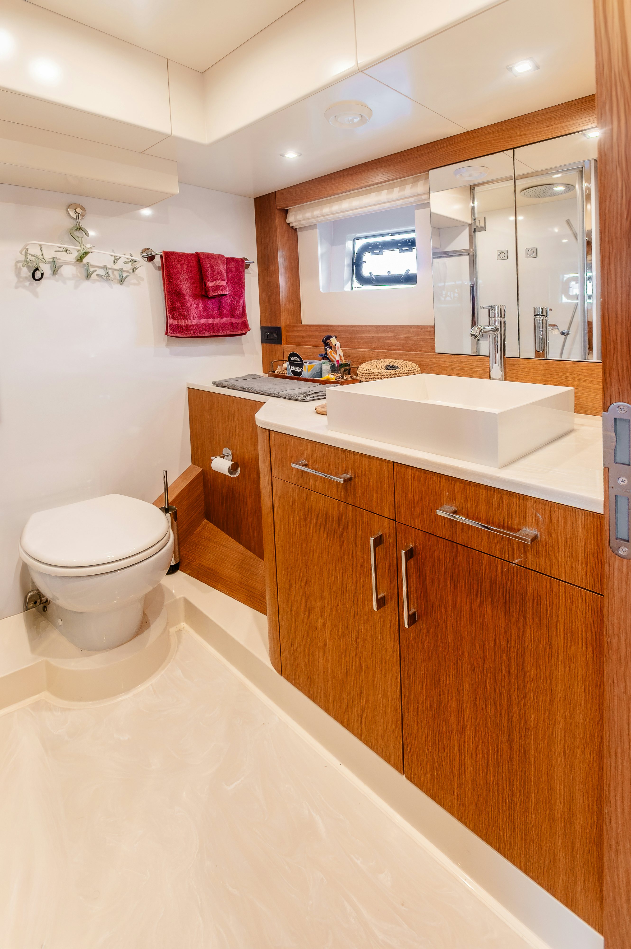 a bathroom with a toilet and a sink aboard VIAKAREY Yacht for Sale