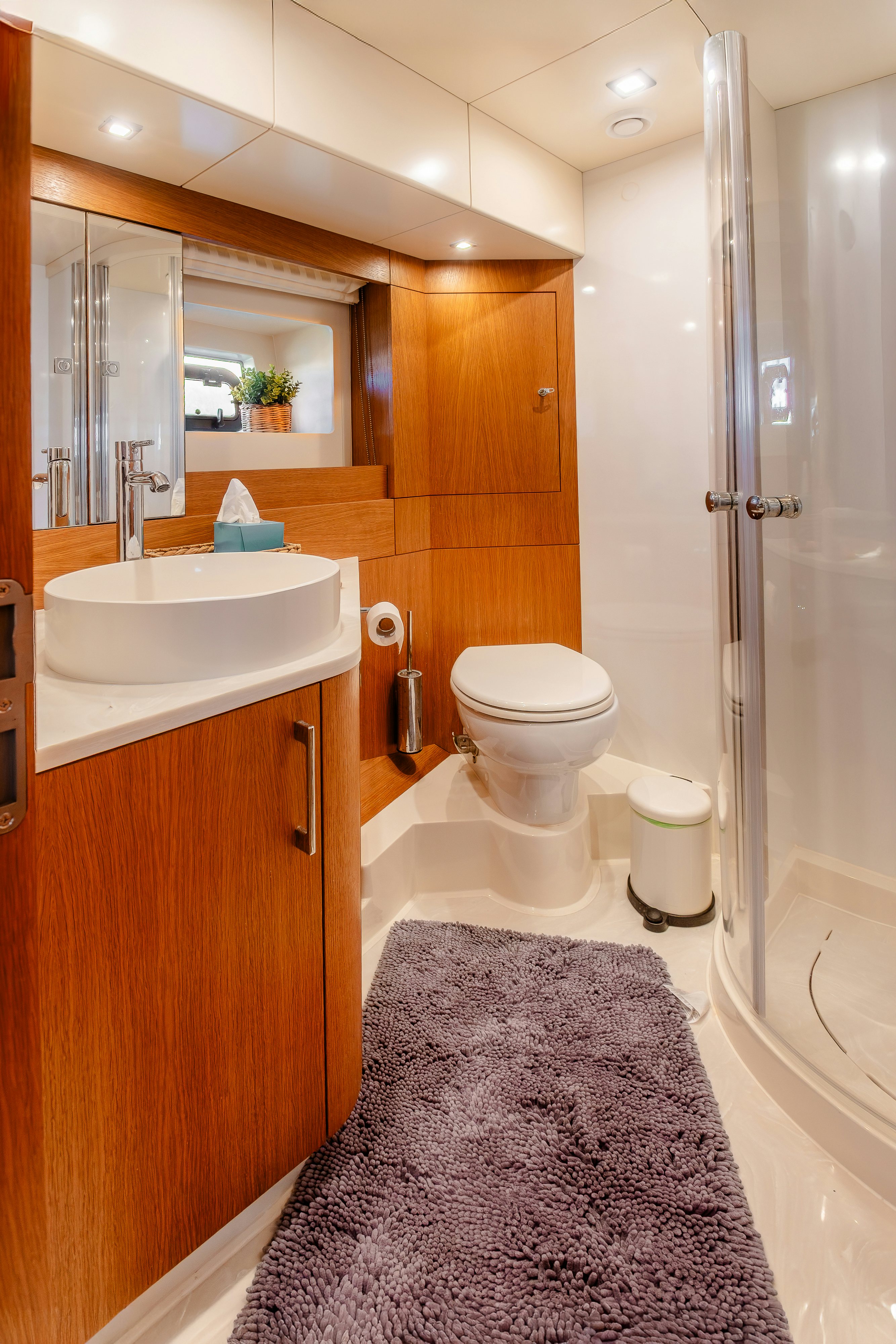 a bathroom with a sink toilet and a shower aboard VIAKAREY Yacht for Sale