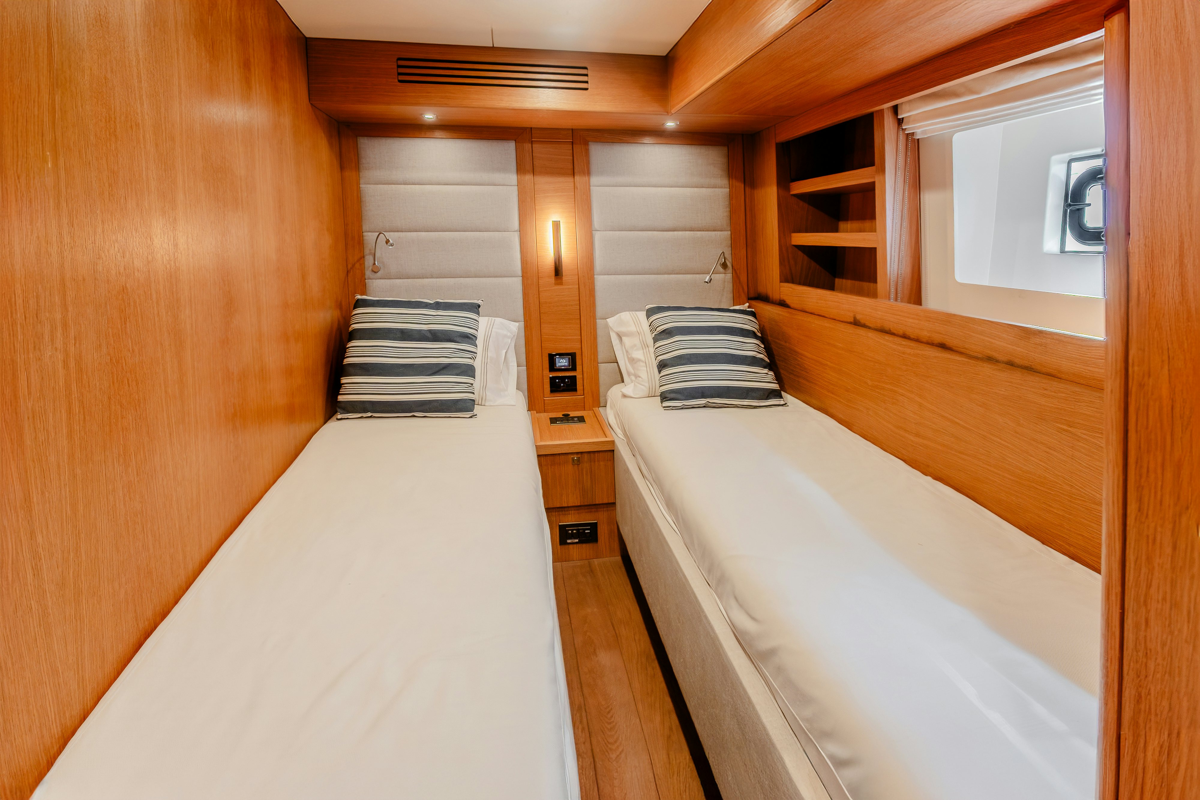 a room with two beds aboard VIAKAREY Yacht for Sale