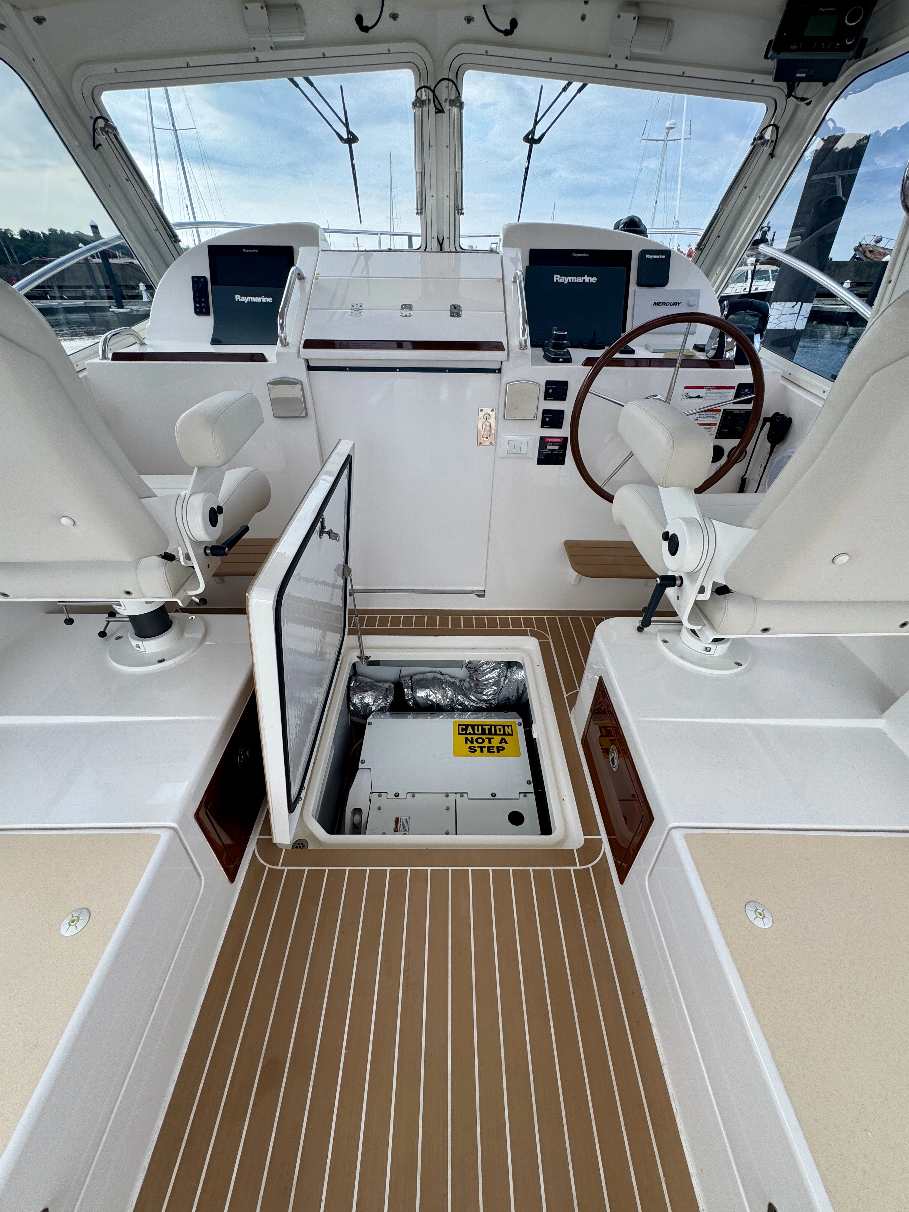a white vehicle with a large window aboard MARE Yacht for Sale