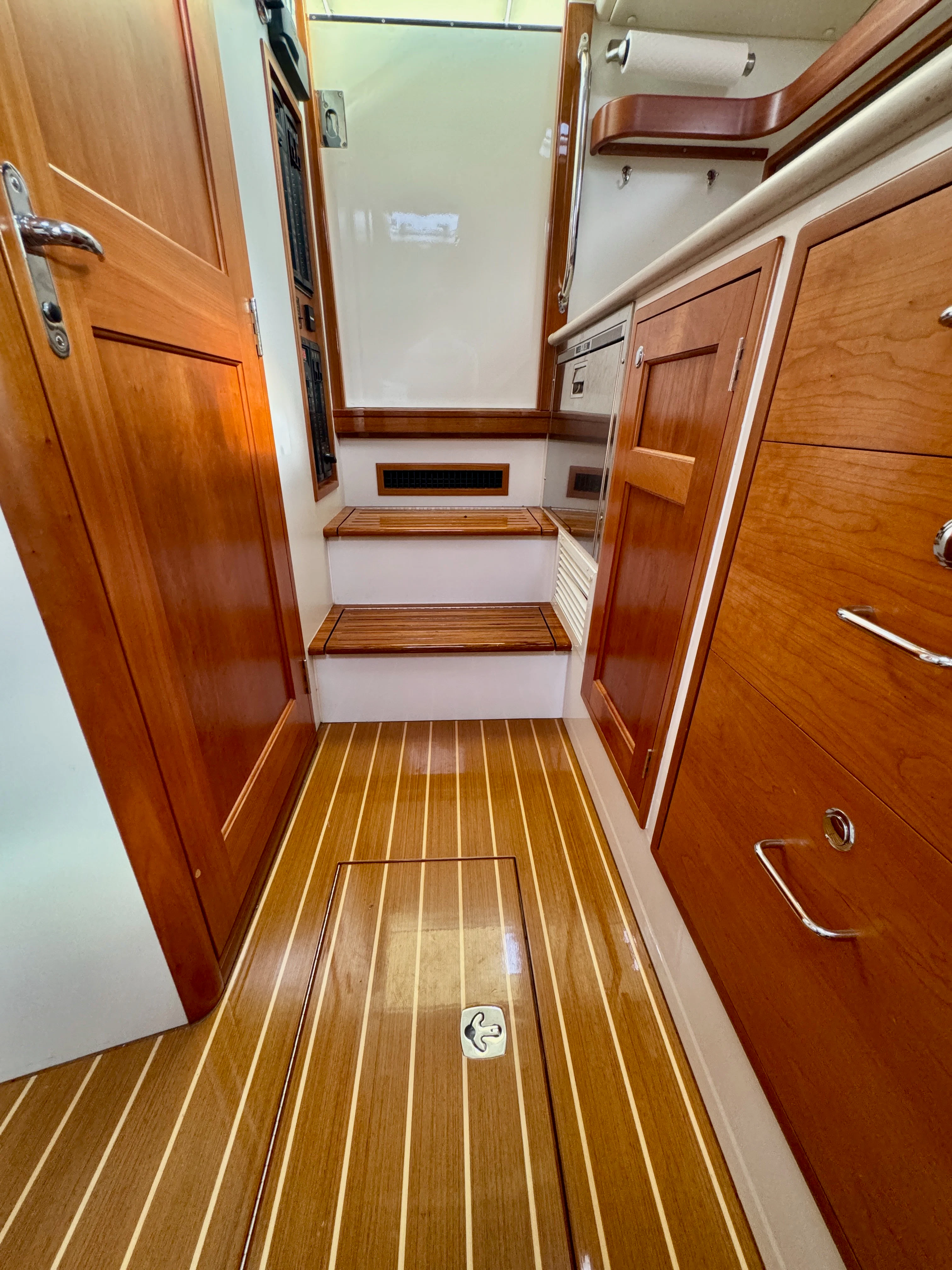 a hallway with wooden cabinets aboard MARE Yacht for Sale