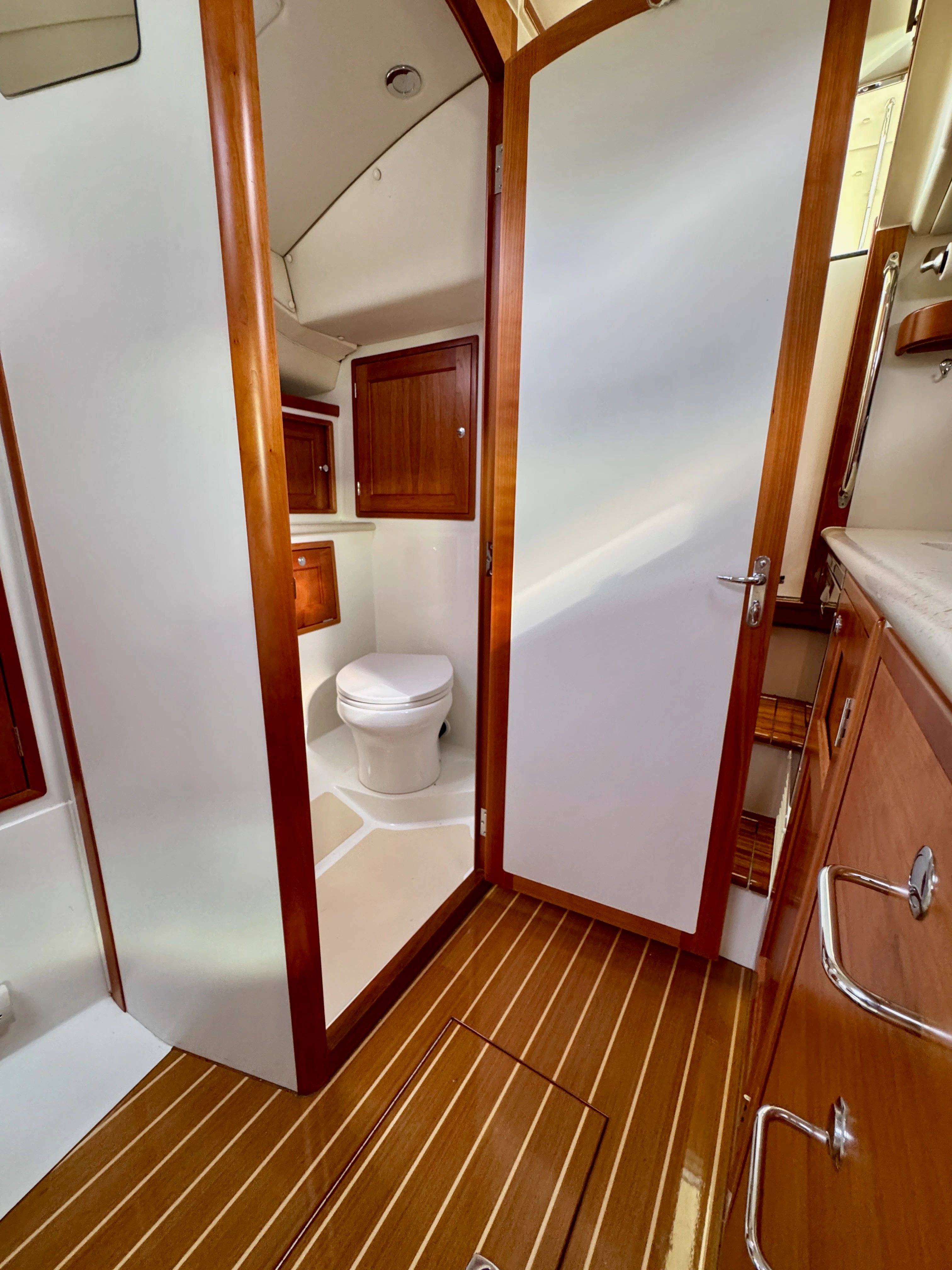 a bathroom with a toilet and a shower aboard MARE Yacht for Sale
