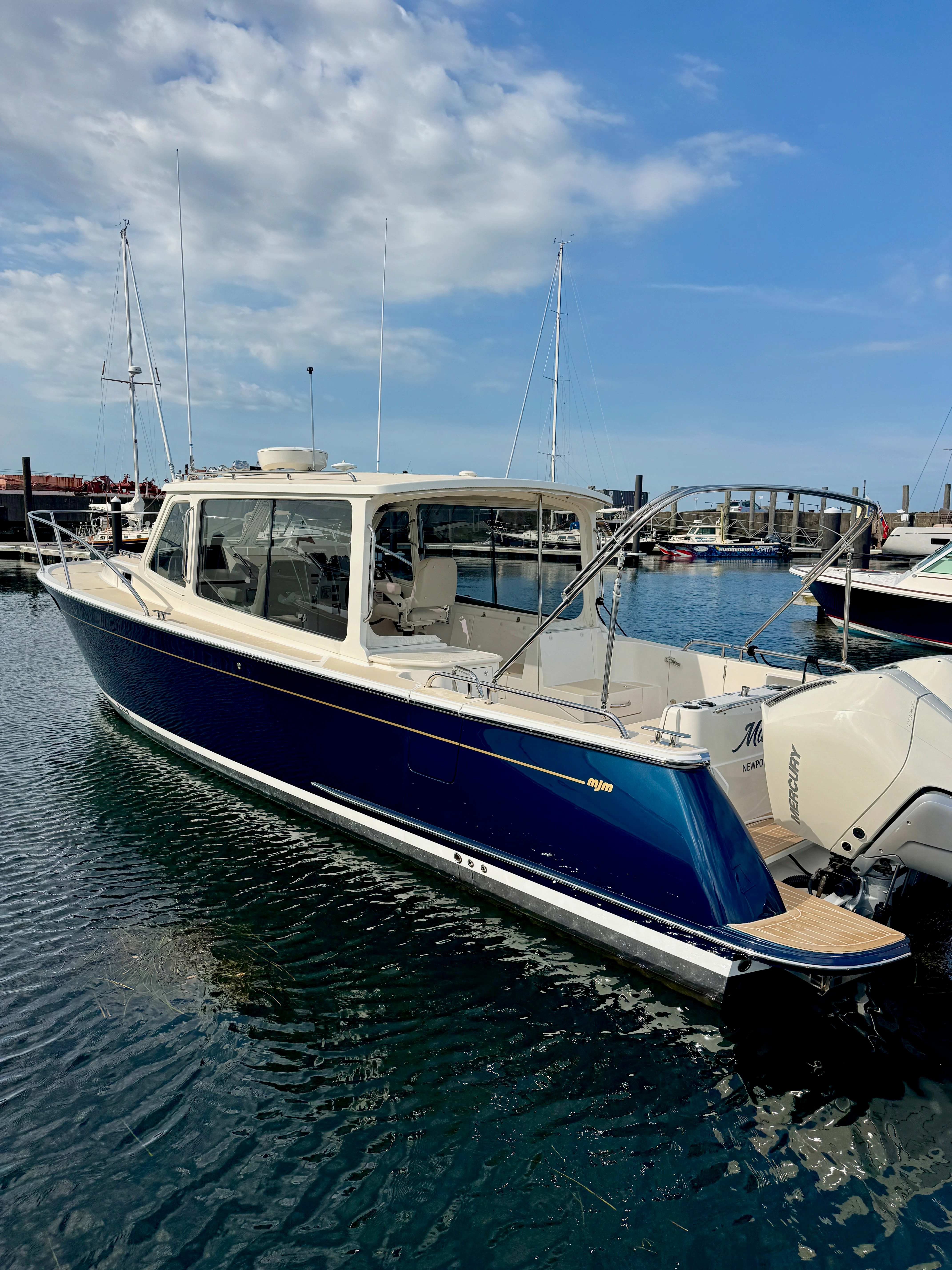 a boat docked at a pier aboard MARE Yacht for Sale