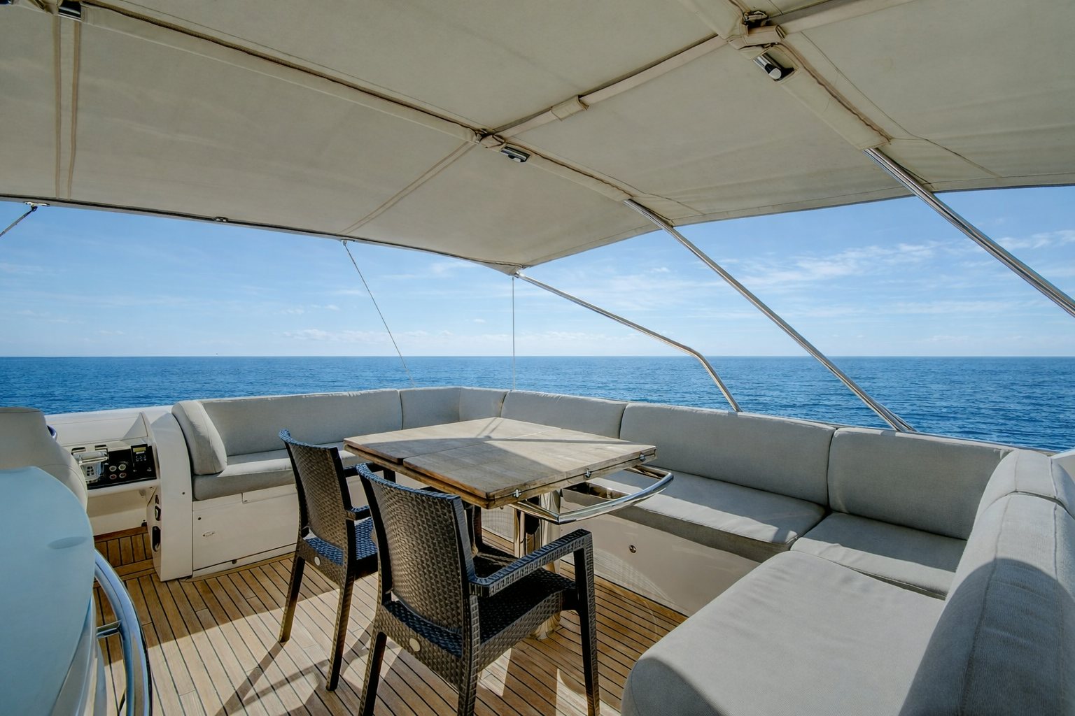 a boat with a table and chairs on a deck aboard GRAND CRU Yacht for Sale