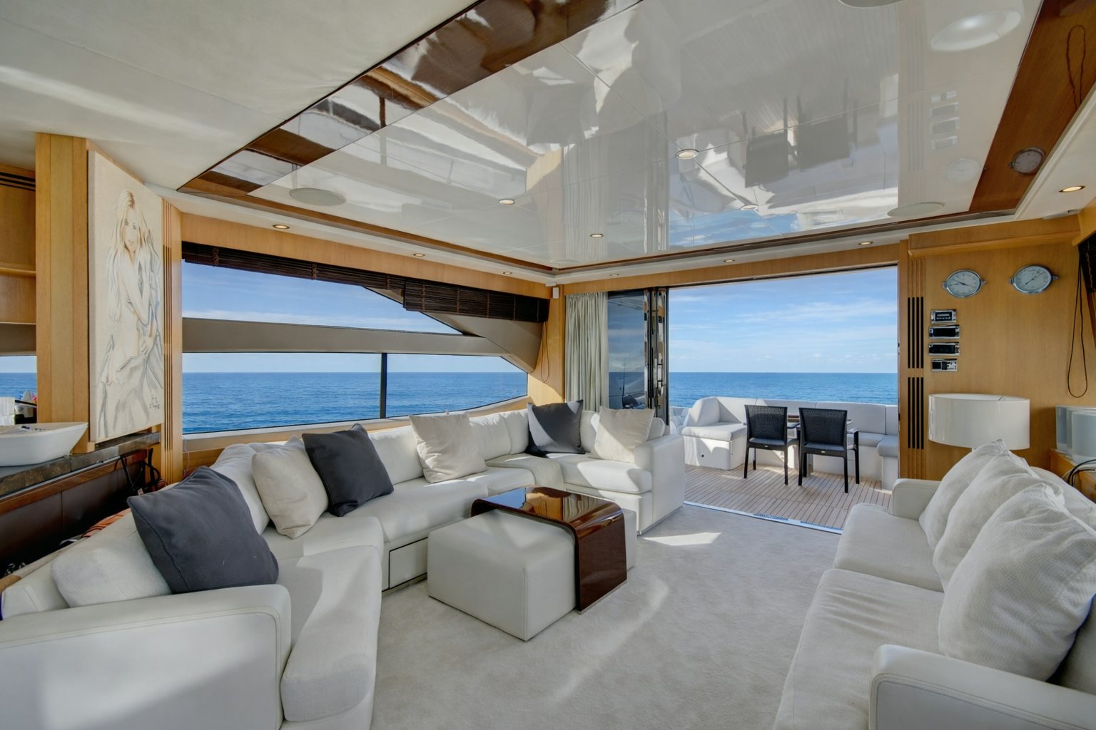 a room with a couch and a large window aboard GRAND CRU Yacht for Sale