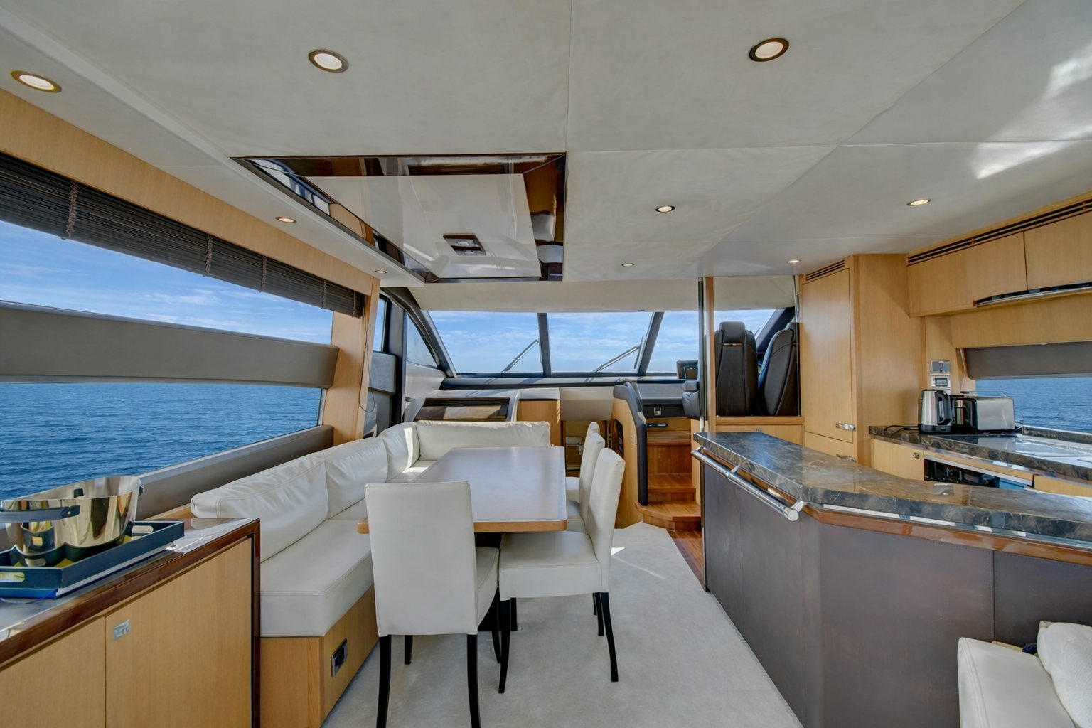 a kitchen with a large window aboard GRAND CRU Yacht for Sale