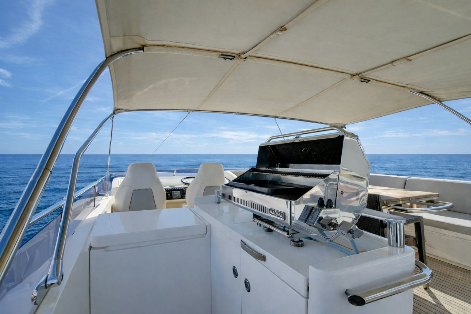 a boat with a deck and chairs on it aboard GRAND CRU Yacht for Sale