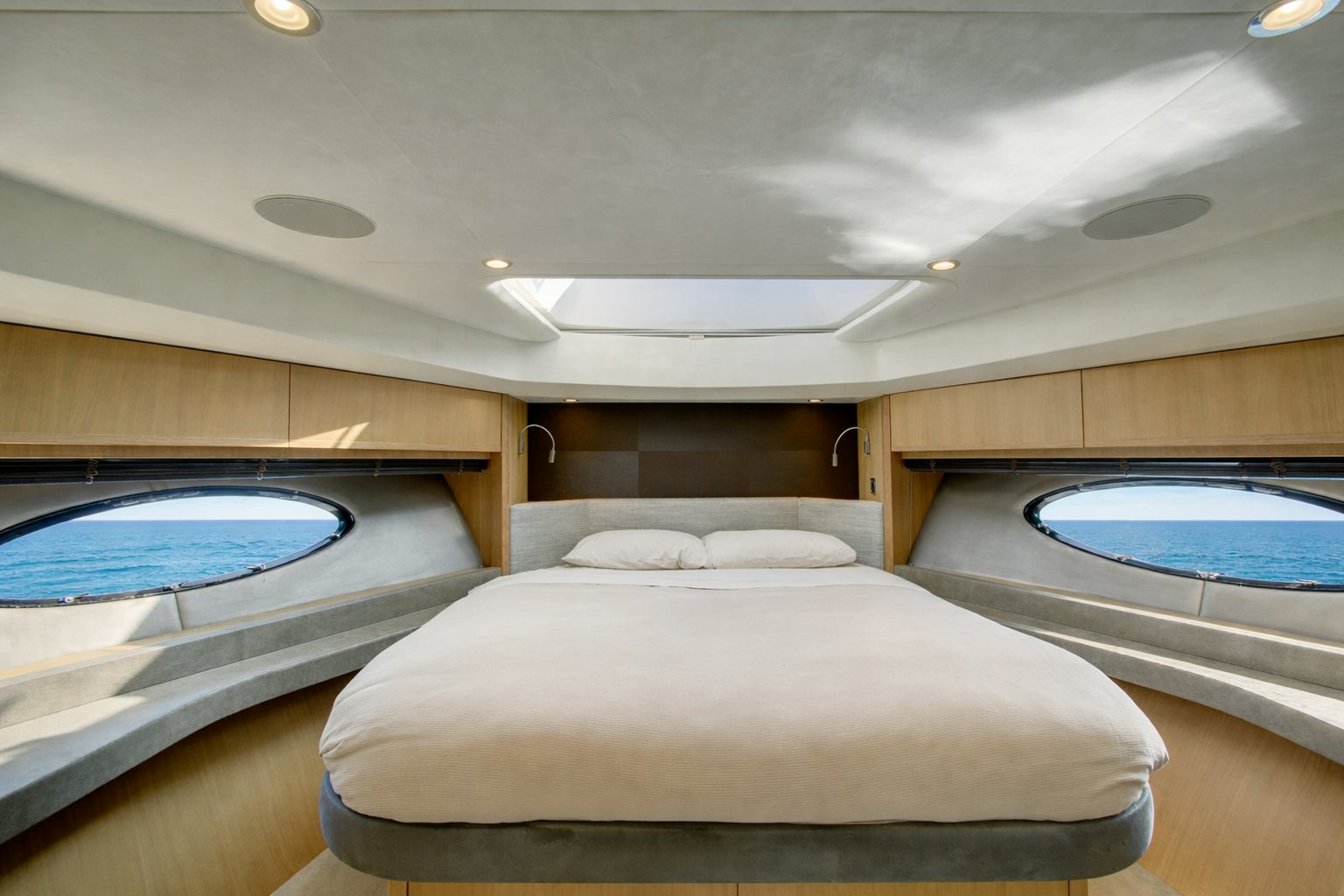 a room with a bed and a pool aboard GRAND CRU Yacht for Sale