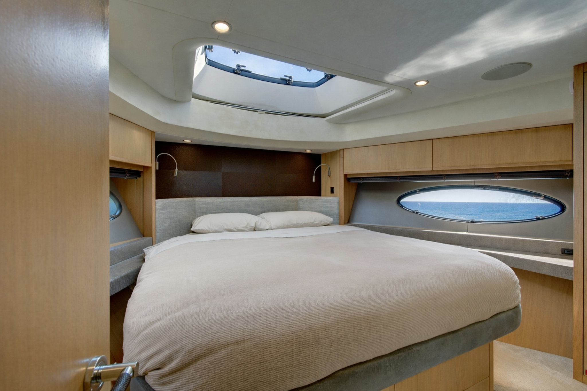 a room with a bed and a window aboard GRAND CRU Yacht for Sale