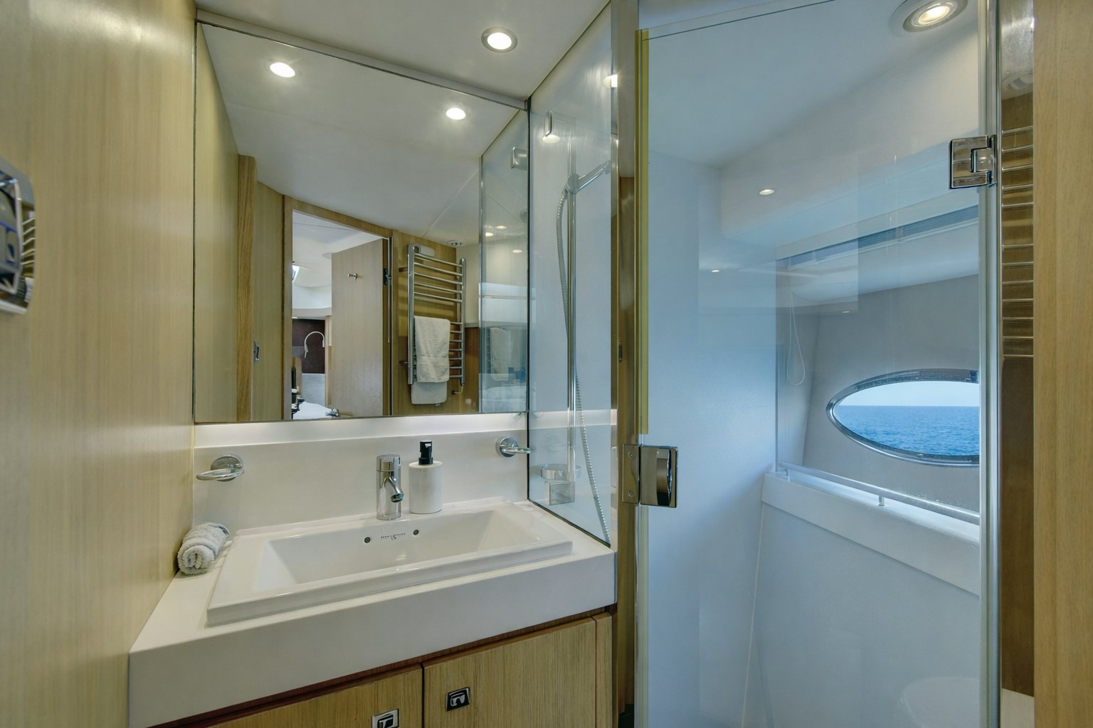 a bathroom with a large mirror aboard GRAND CRU Yacht for Sale