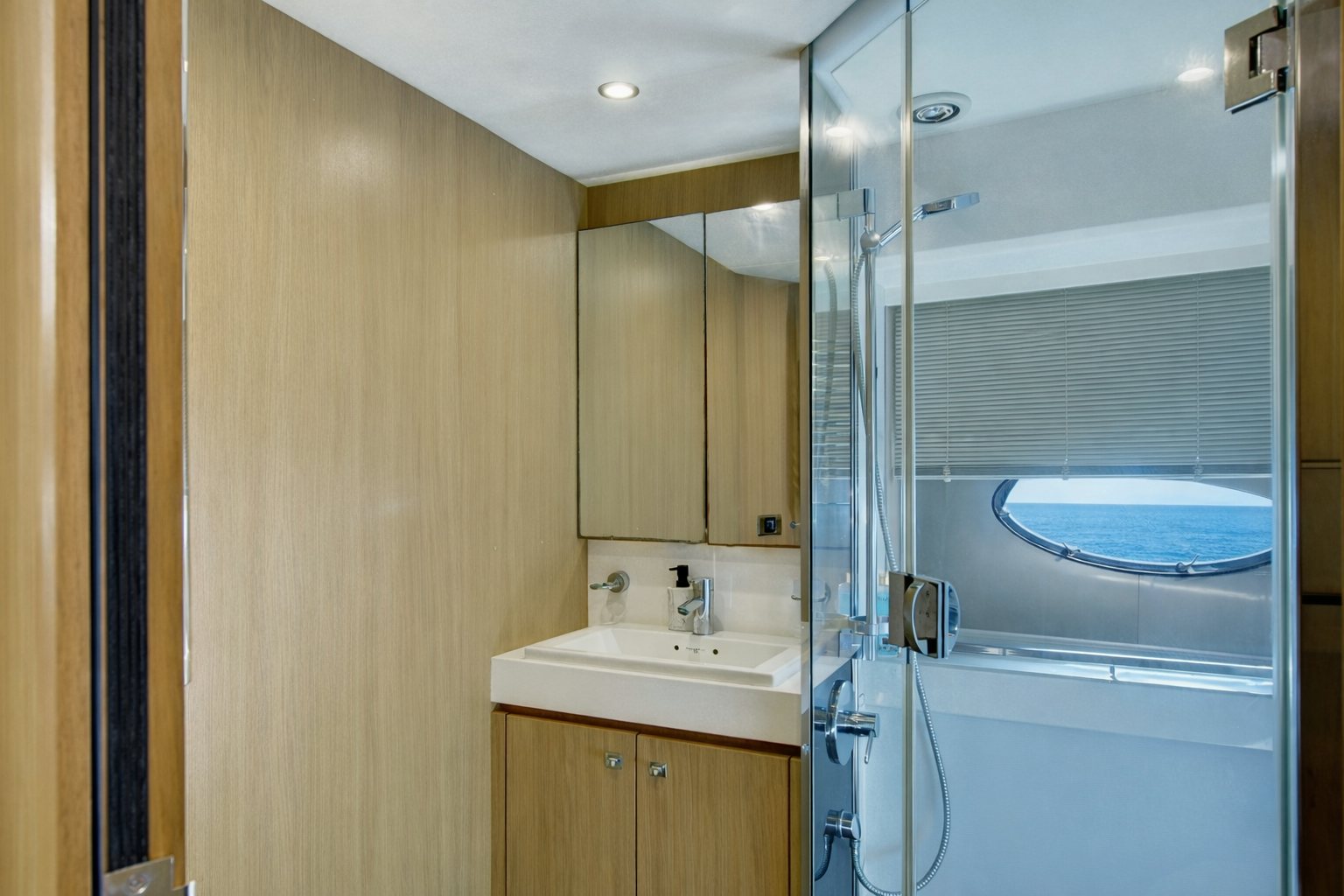 a bathroom with a shower unit and sink aboard GRAND CRU Yacht for Sale