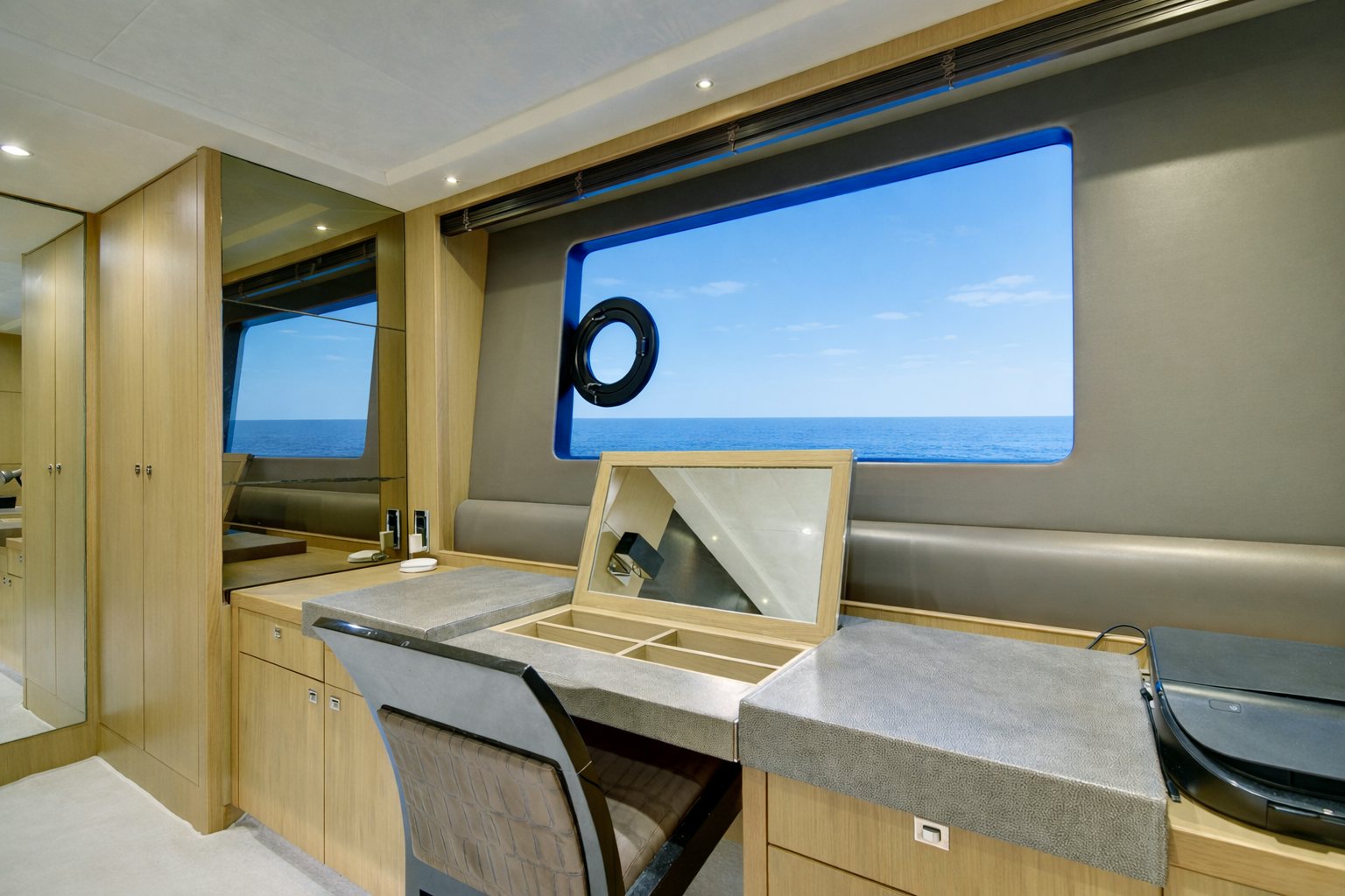 a room with a desk and a large screen aboard GRAND CRU Yacht for Sale