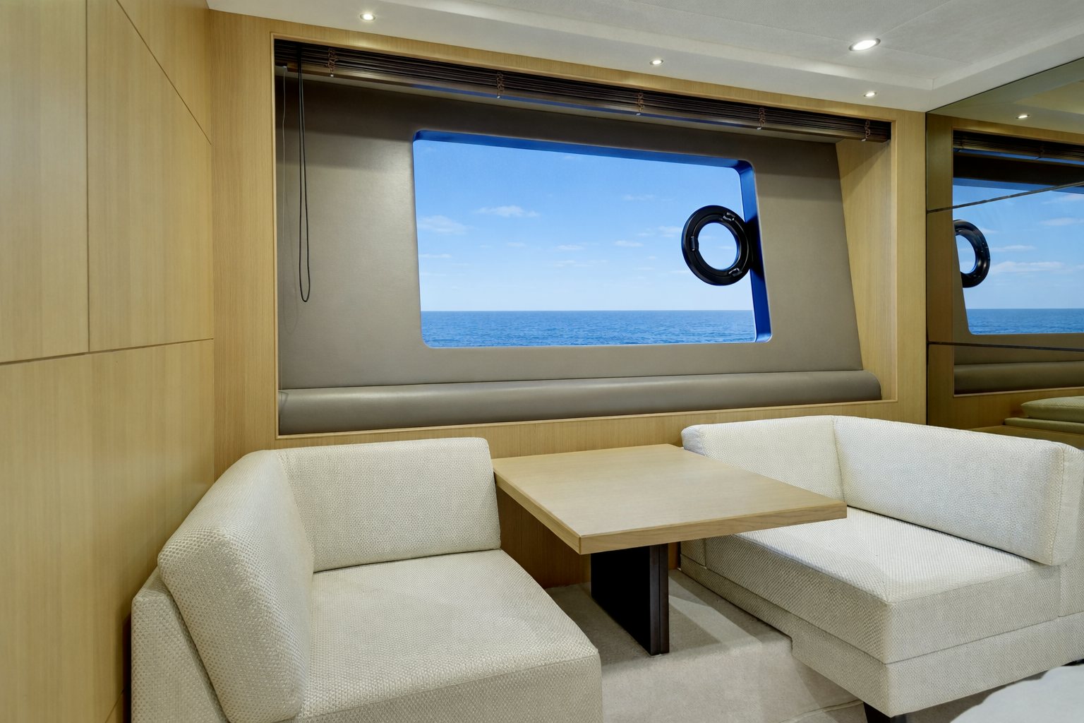 a room with a couch and a tv on the wall aboard GRAND CRU Yacht for Sale