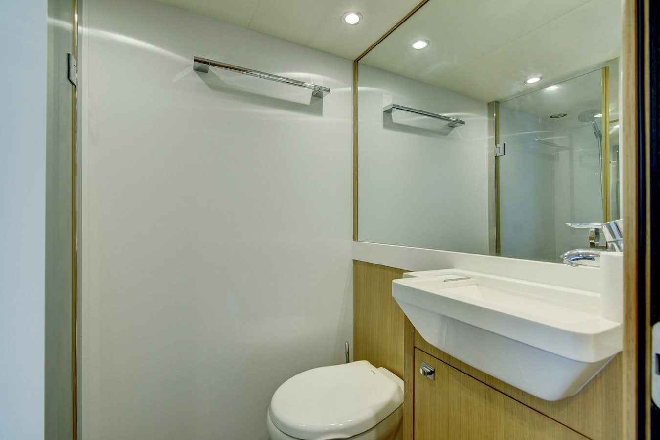 a bathroom with a toilet and a sink aboard GRAND CRU Yacht for Sale