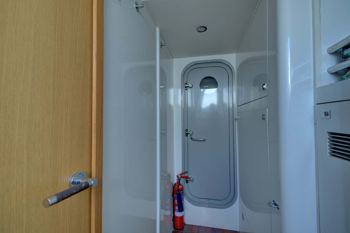 a room with white doors aboard GRAND CRU Yacht for Sale