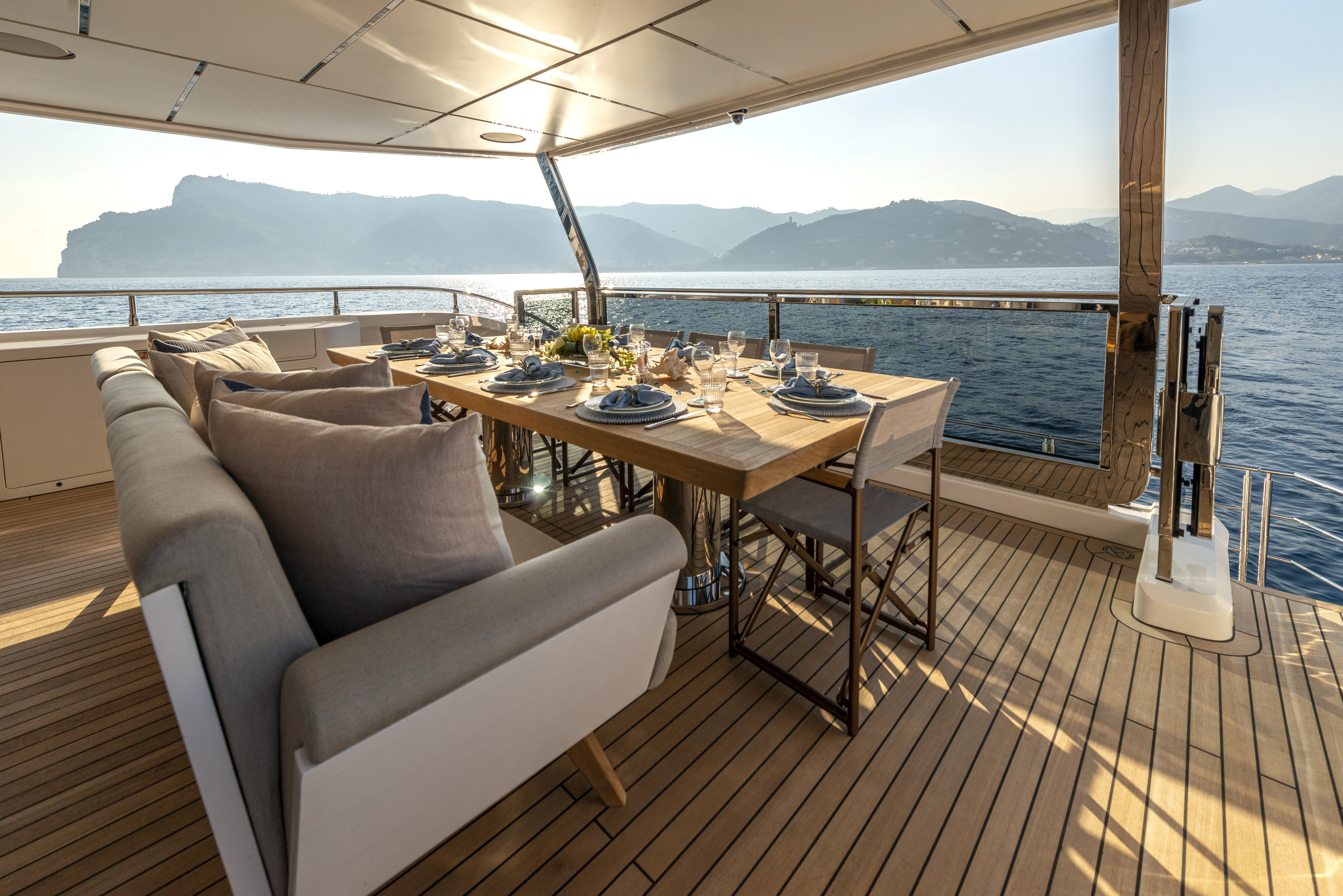 a table and chairs on a deck aboard ALKHADRA Yacht for Charter