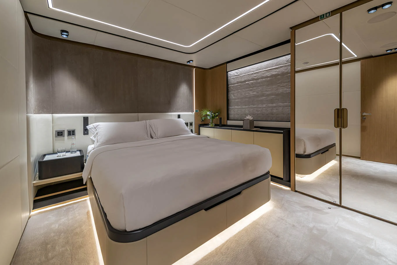 a room with a bed and a closet aboard ALKHADRA Yacht for Charter