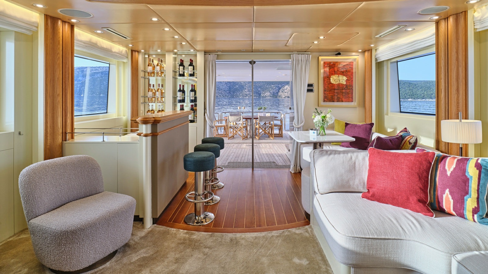 a living room with a couch and a table aboard GELLY Yacht for Charter