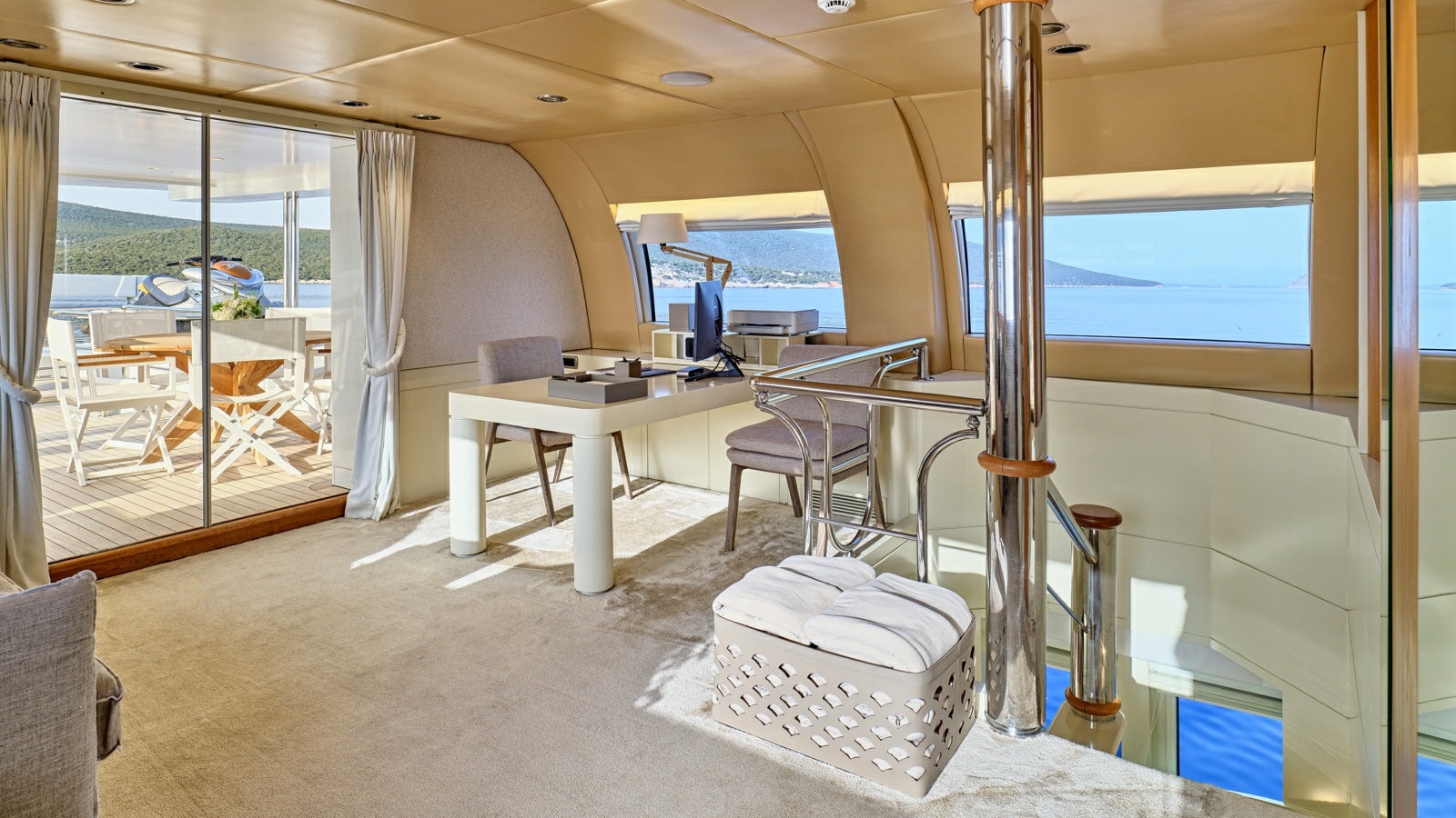 a room with a desk and a bed aboard GELLY Yacht for Charter
