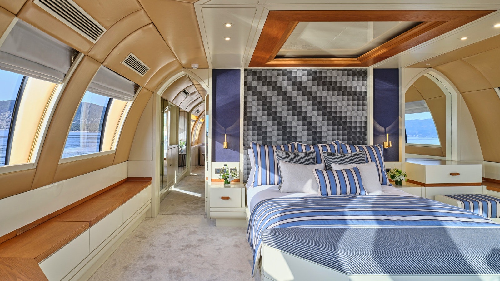 a room with a bed and a blue bed aboard GELLY Yacht for Charter