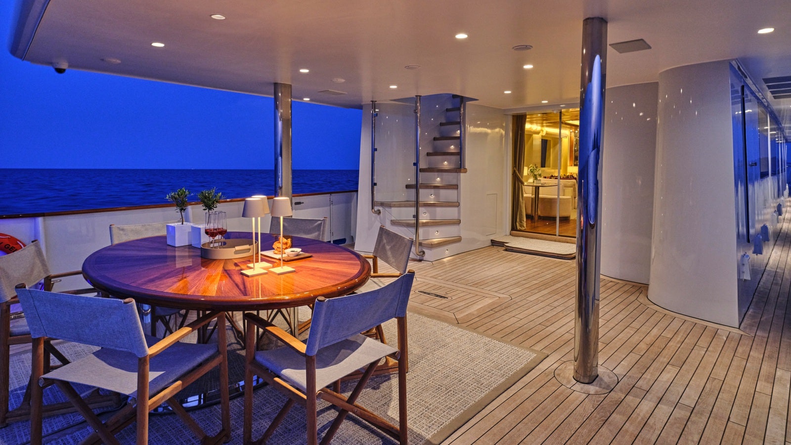 a large room with a table and chairs aboard GELLY Yacht for Charter