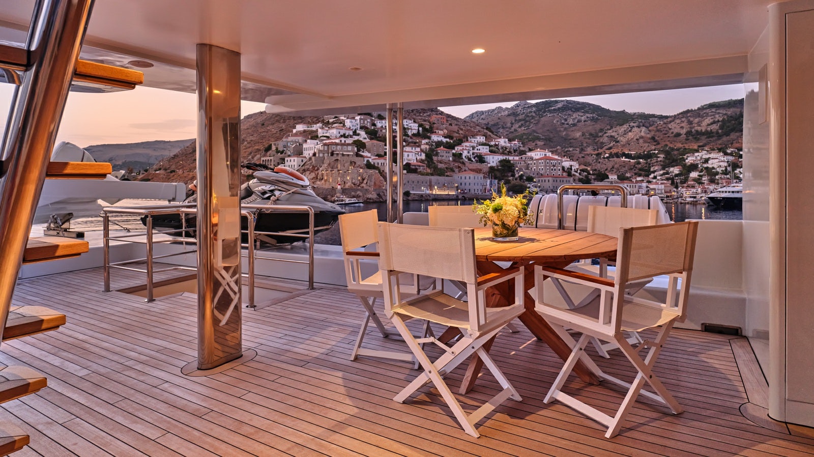 a room with tables and chairs aboard GELLY Yacht for Charter