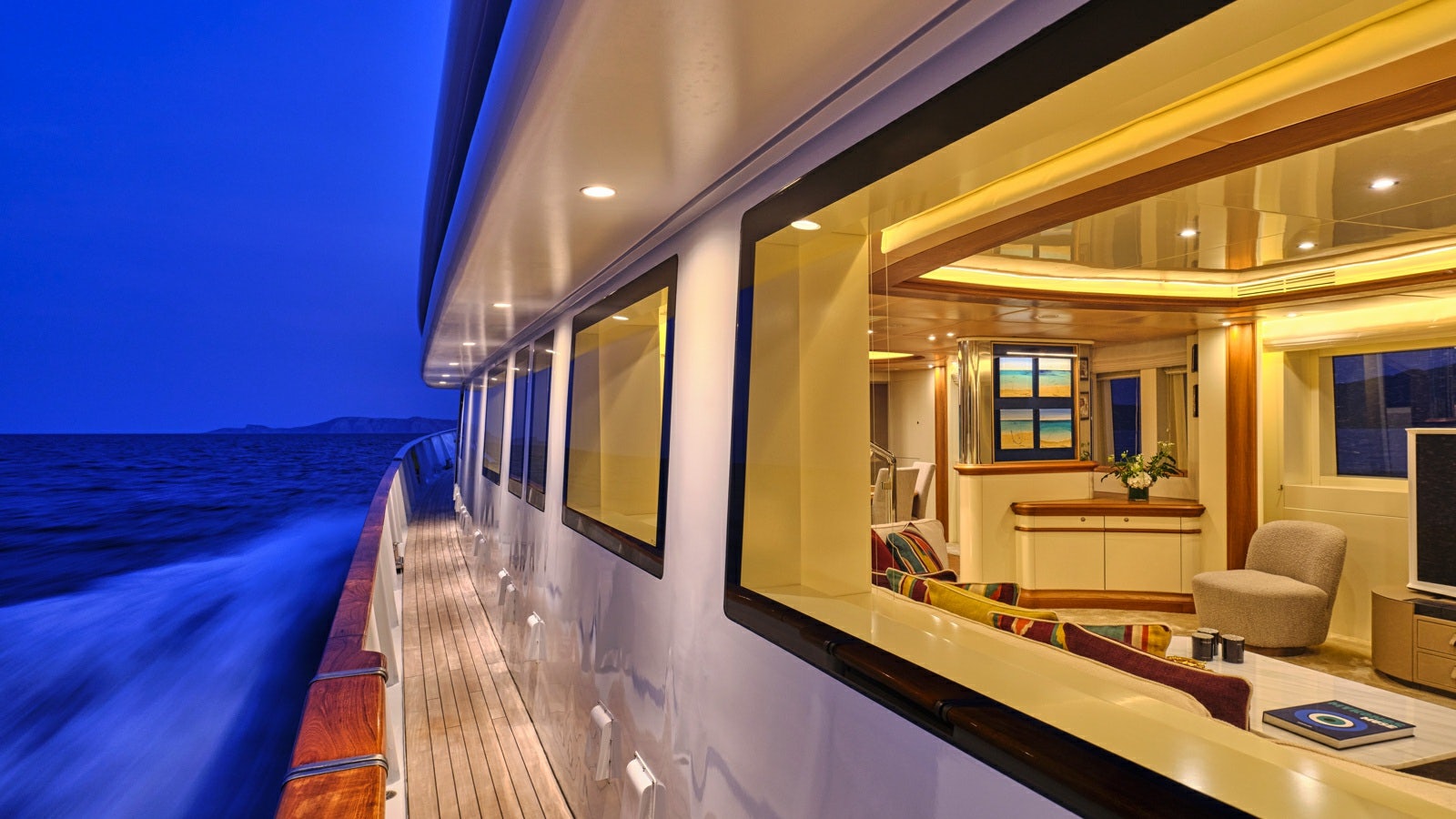 a large room with a bed and a desk aboard GELLY Yacht for Charter