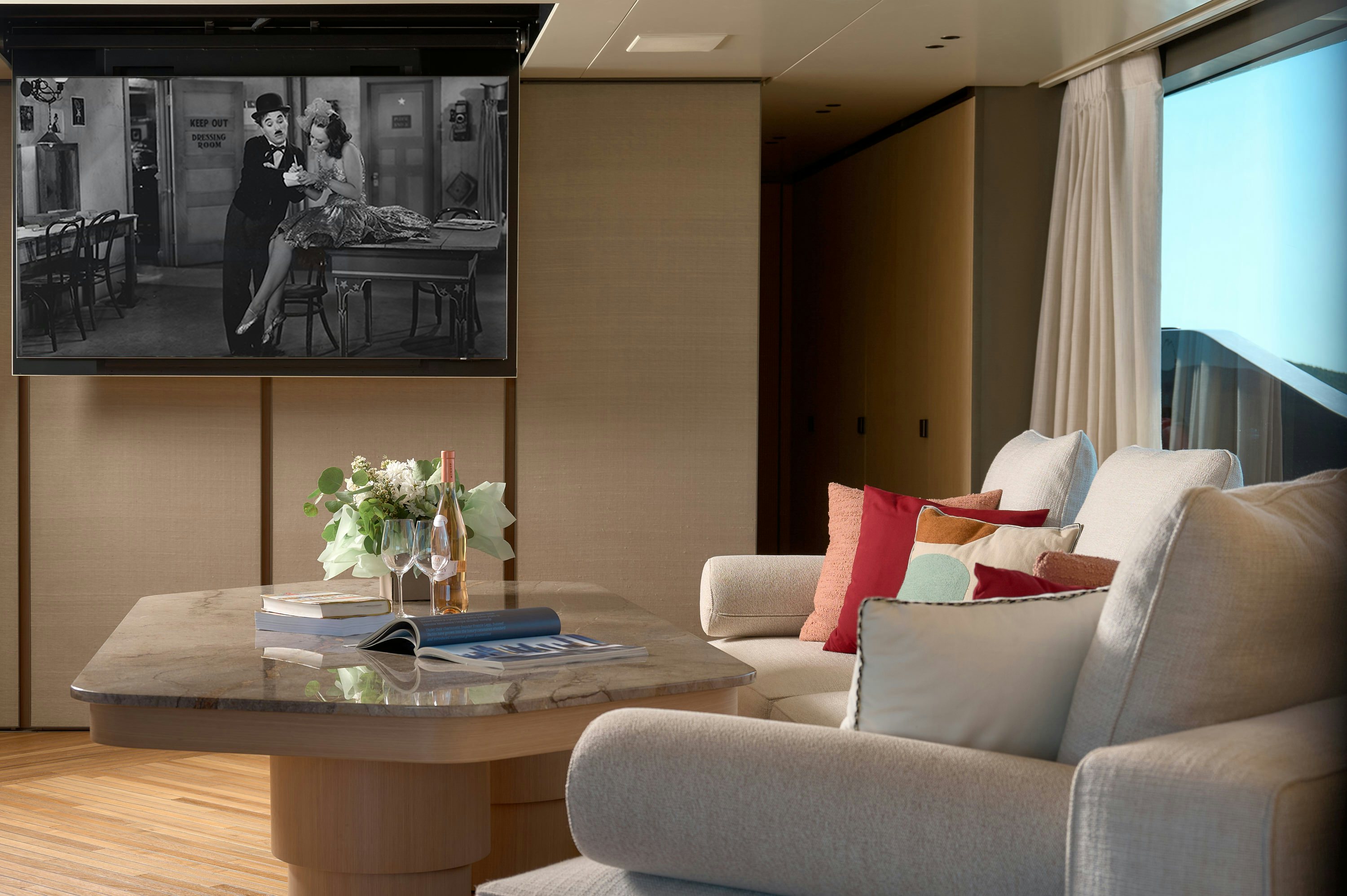 a living room with a table and couches aboard AZZURRI Yacht for Charter