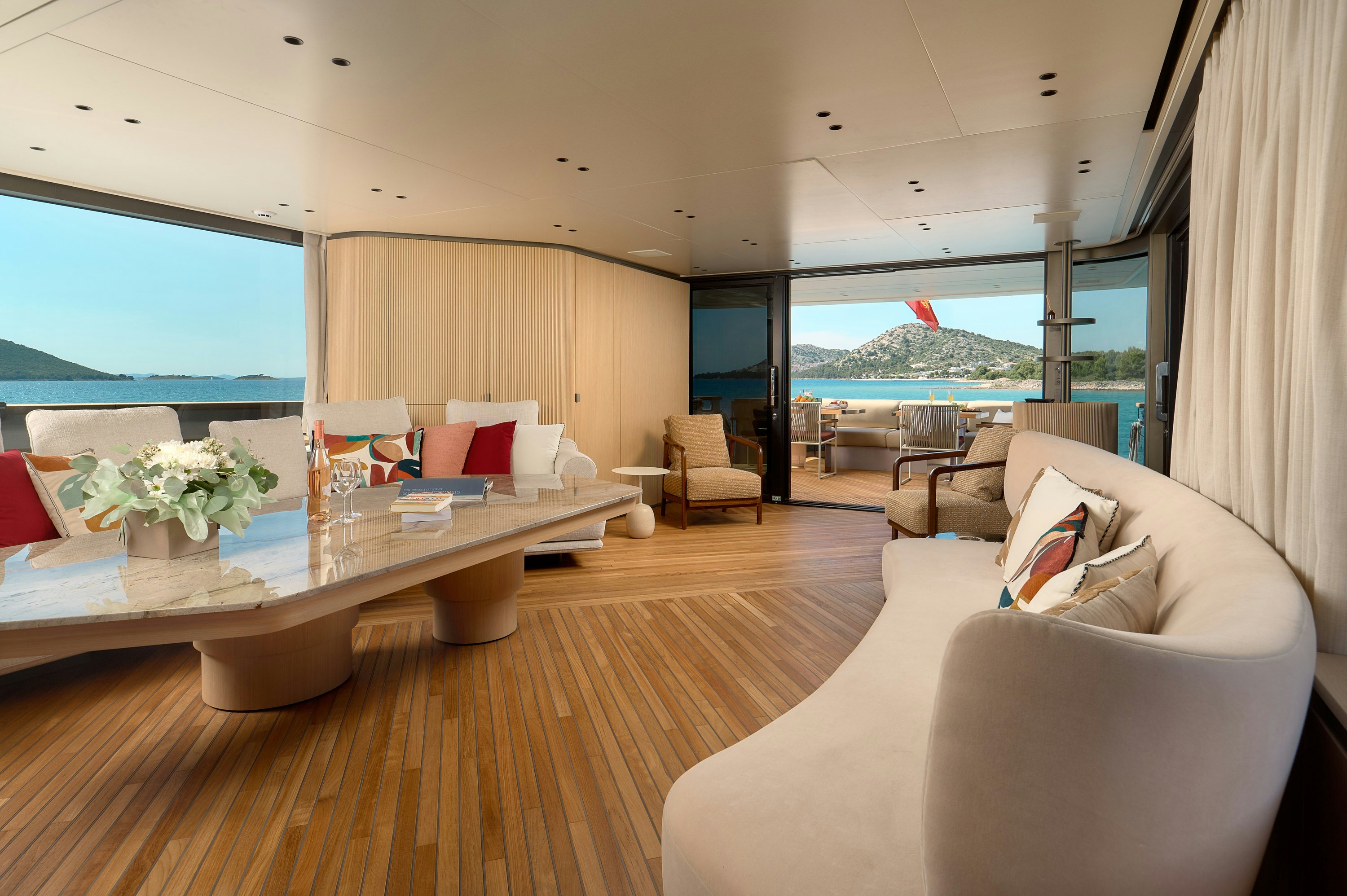 a living room with a large window aboard AZZURRI Yacht for Charter