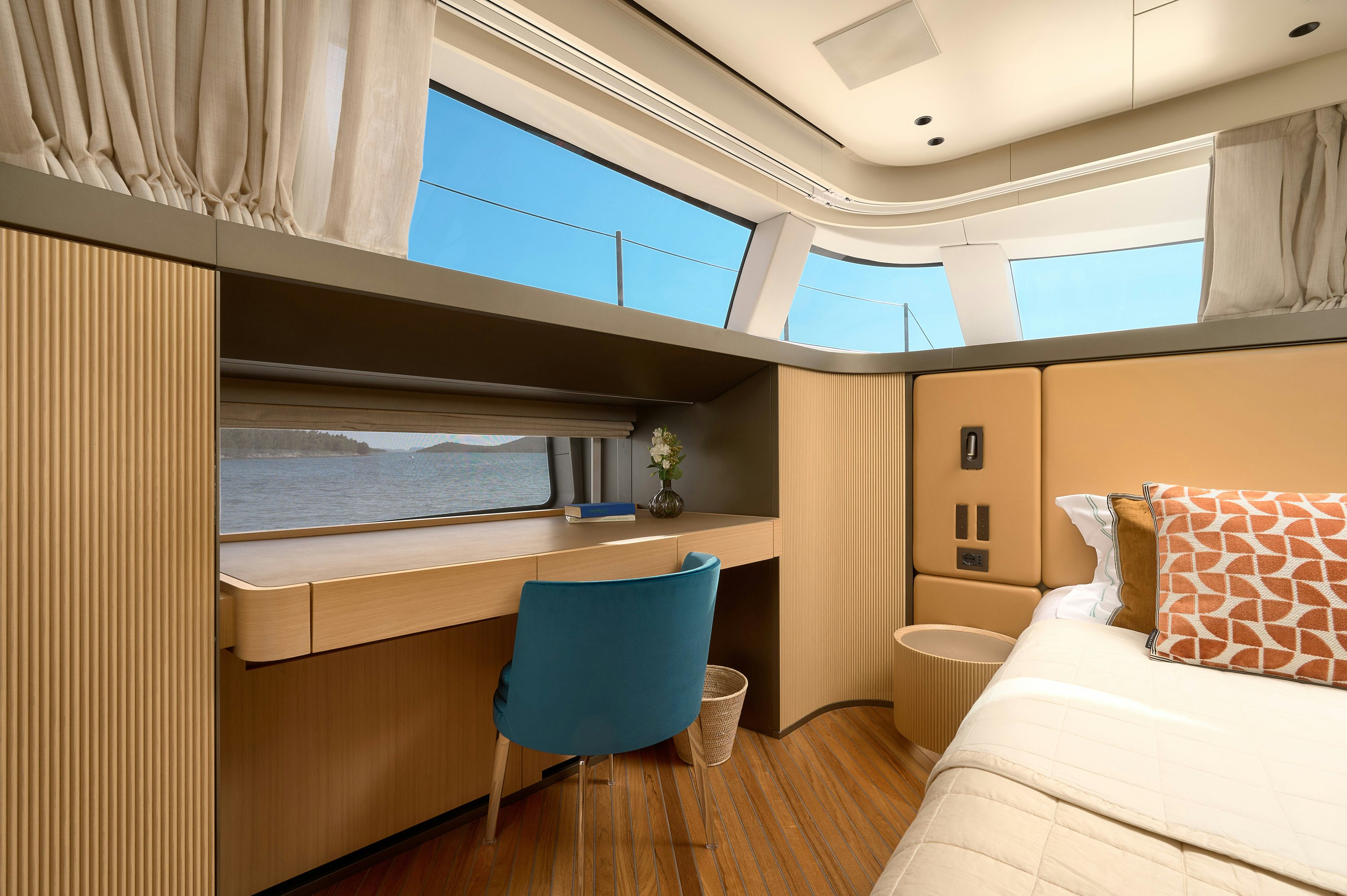 a room with a bed and a desk aboard AZZURRI Yacht for Charter