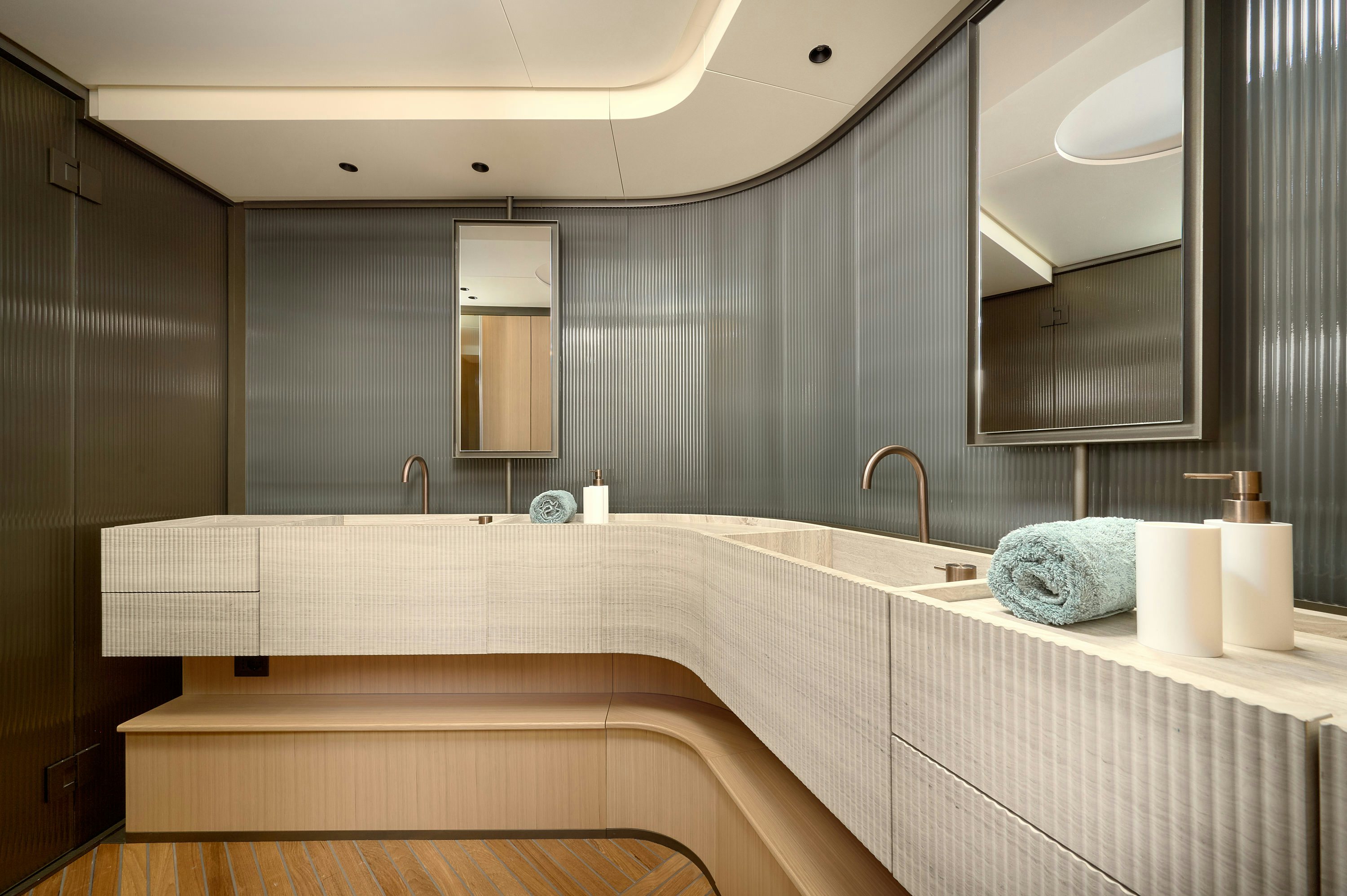 a bathroom with a large mirror aboard AZZURRI Yacht for Charter