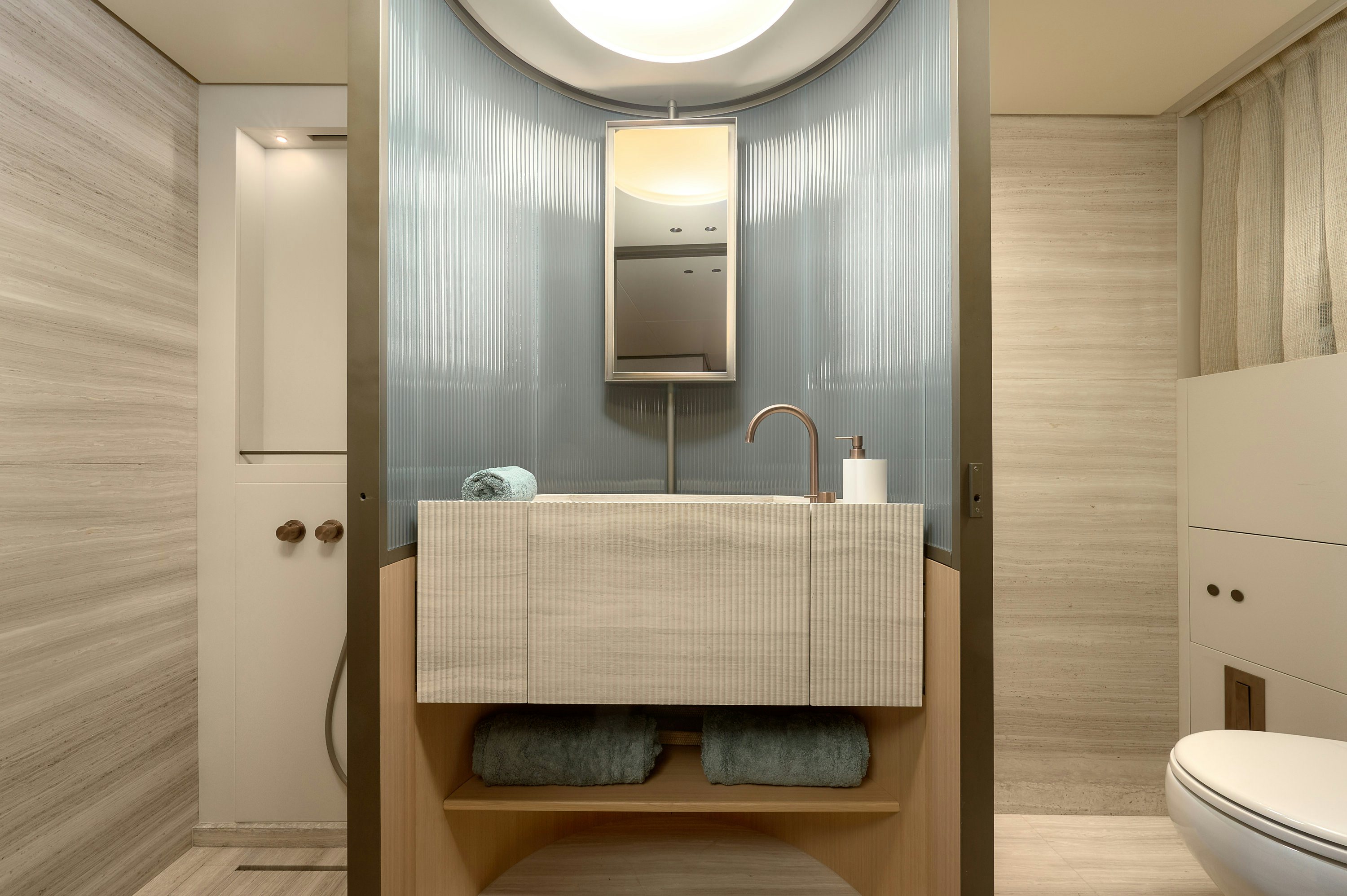 a bathroom with a large mirror aboard AZZURRI Yacht for Charter