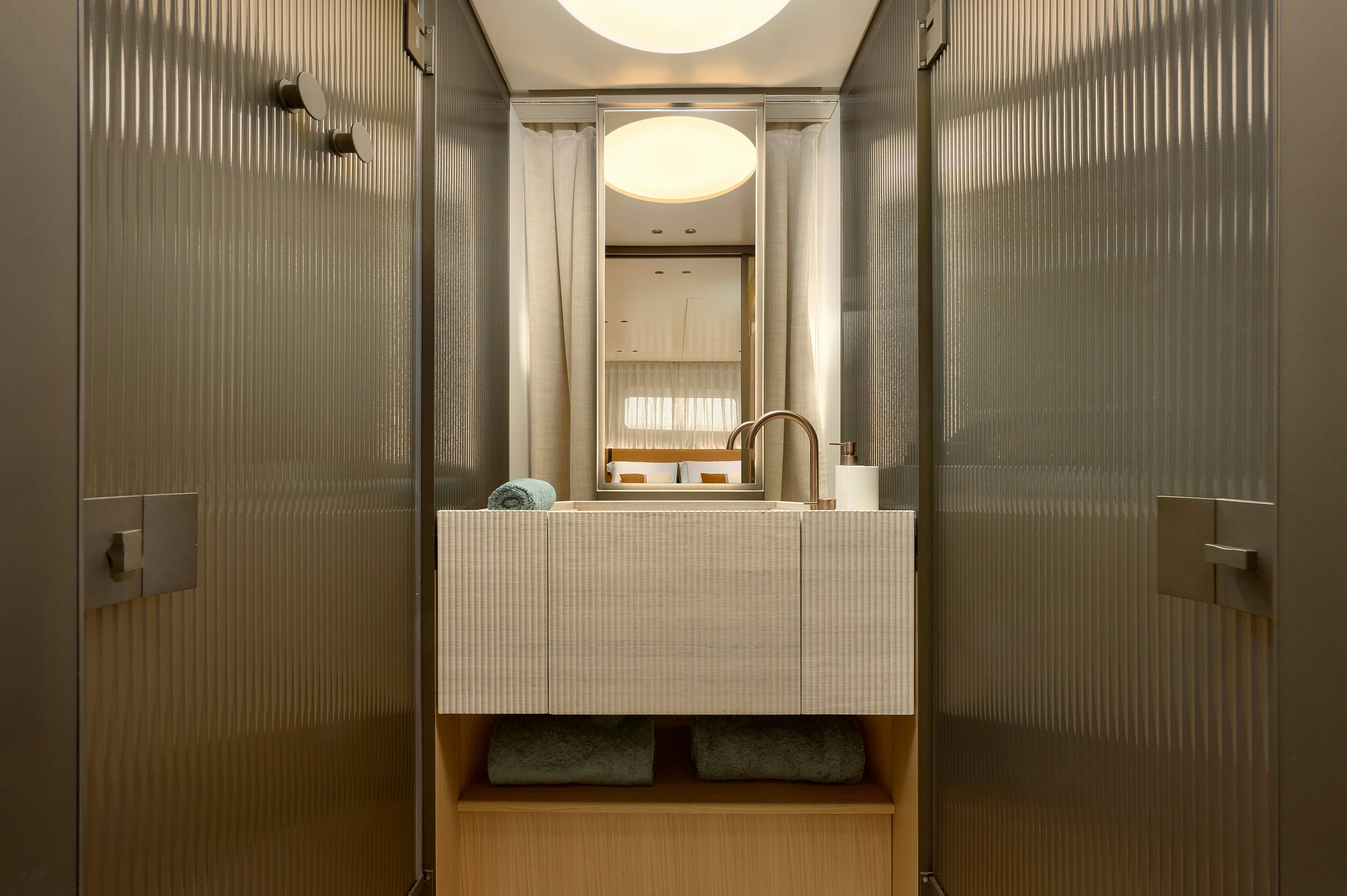 a bathroom with a sink and a mirror aboard AZZURRI Yacht for Charter