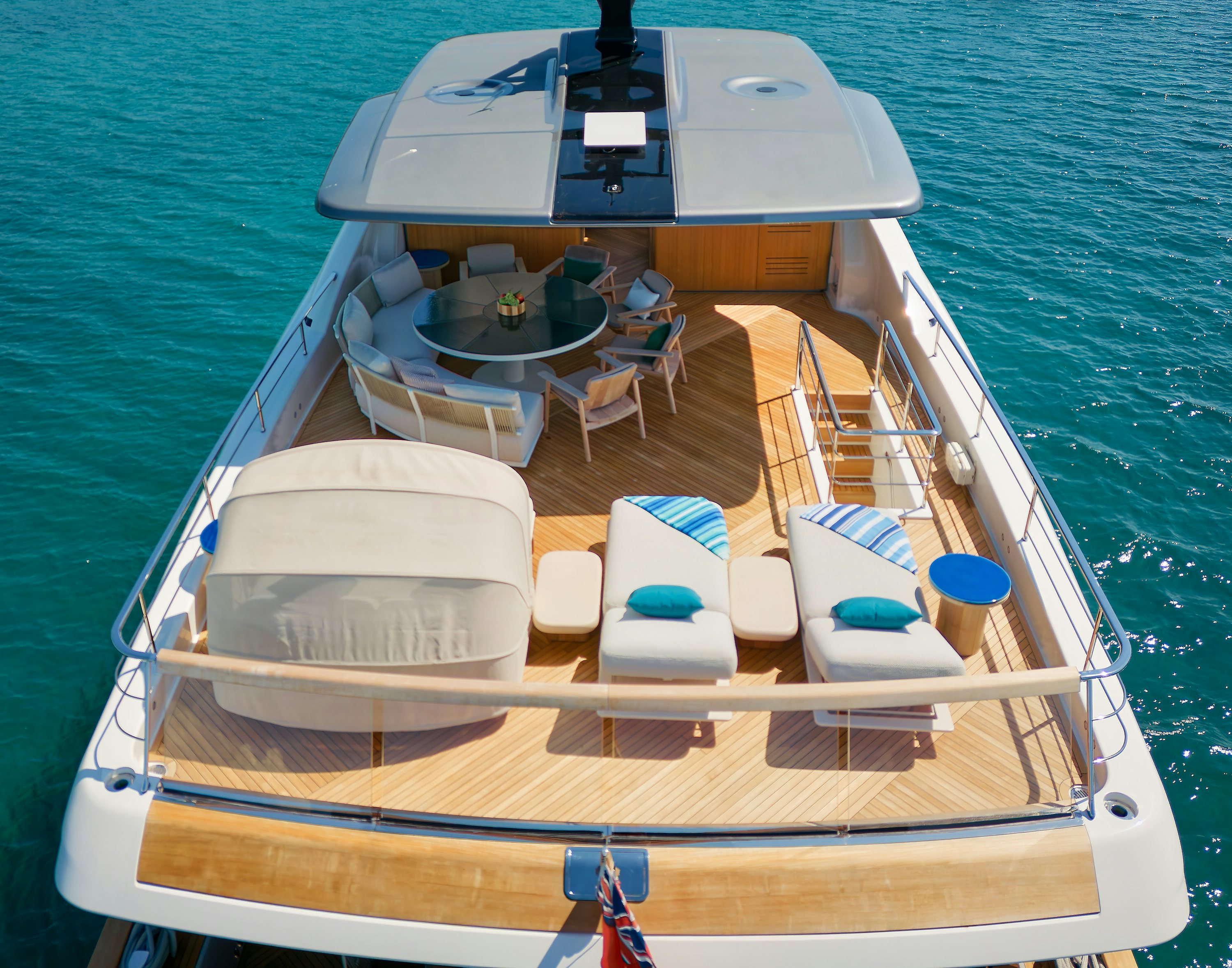 a boat with a deck and chairs on it aboard AZZURRI Yacht for Charter