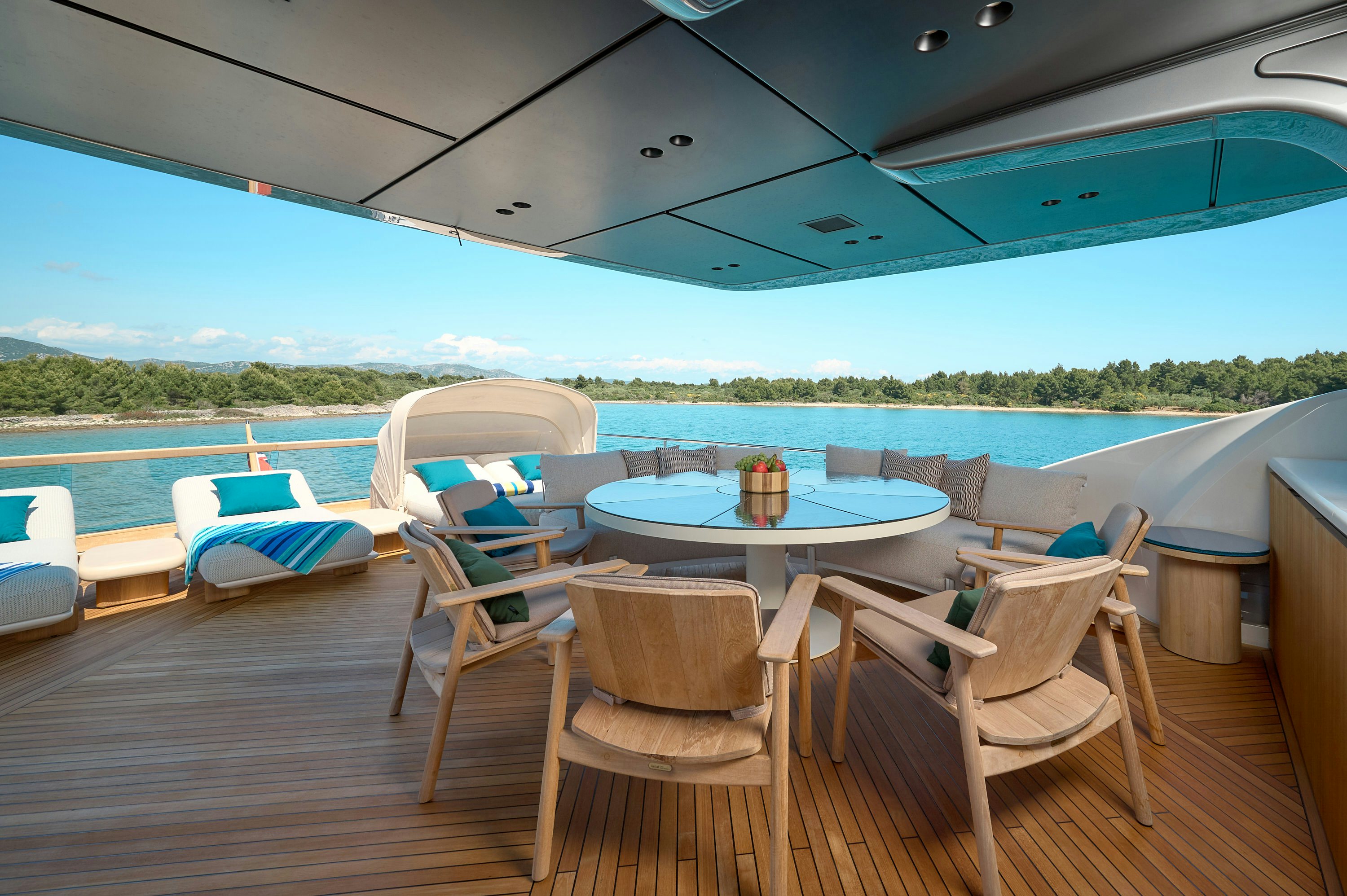 a table and chairs on a deck aboard AZZURRI Yacht for Charter