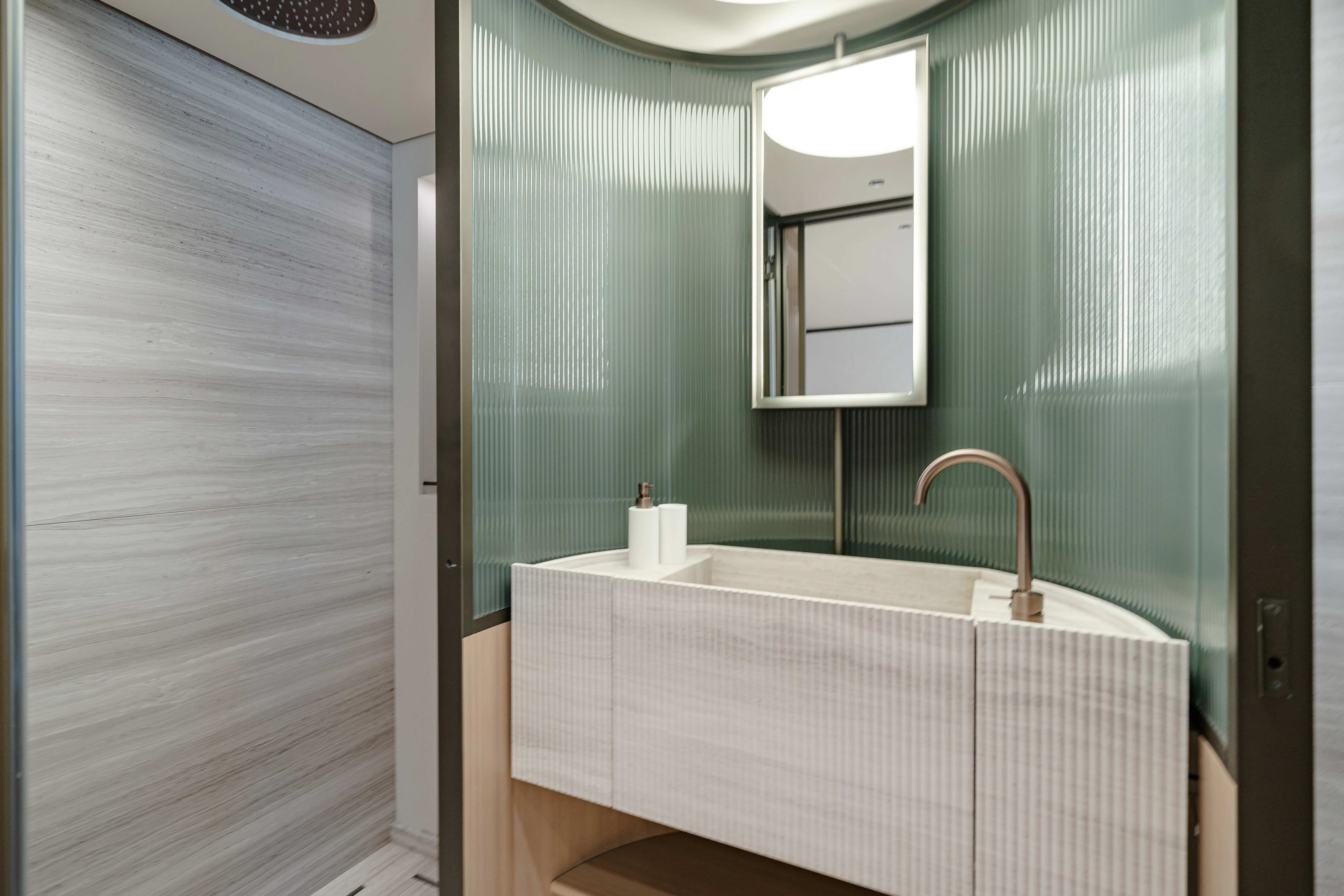 a bathroom with a tub and shower aboard AZZURRI Yacht for Charter