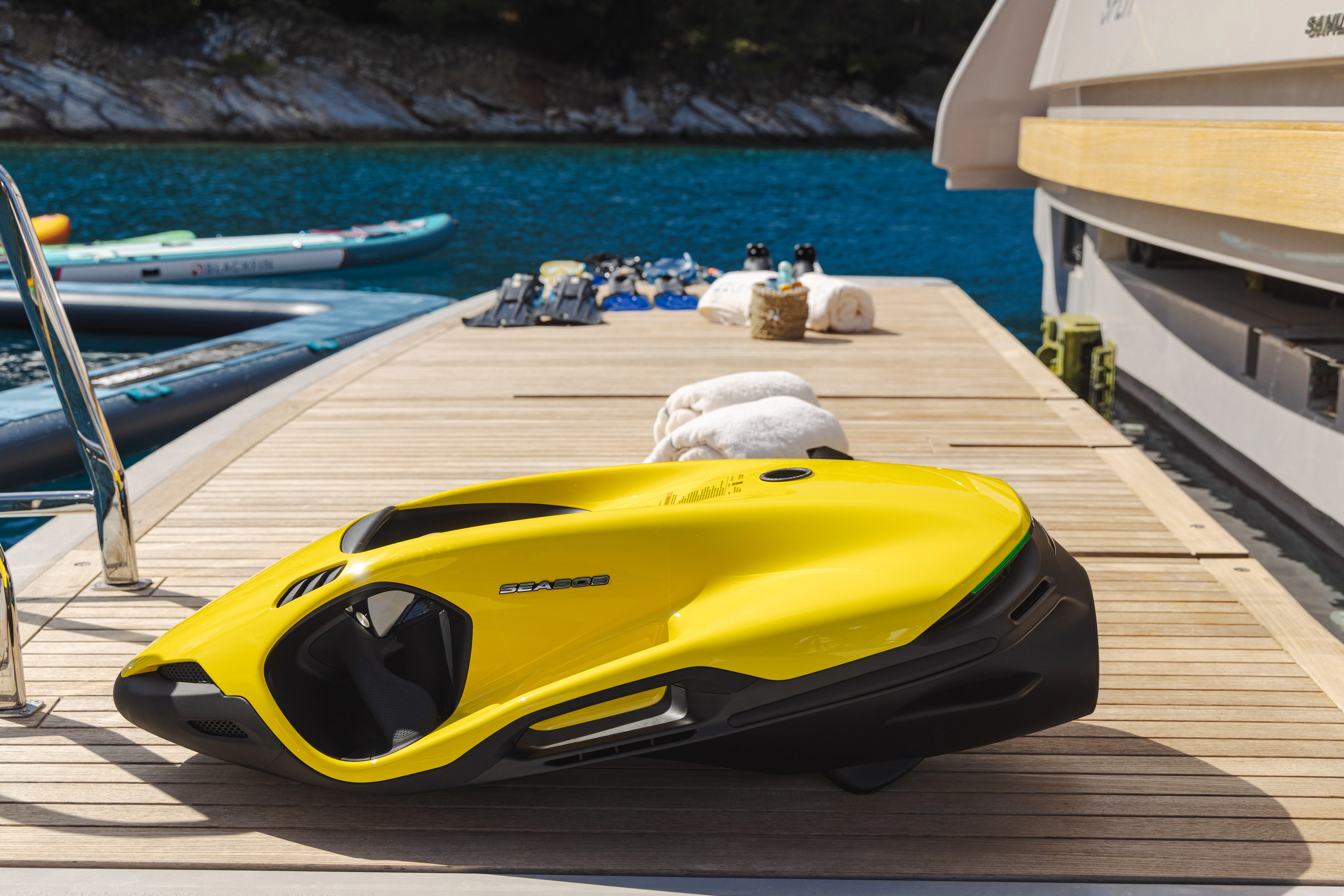 a yellow kayak on a dock aboard AZZURRI Yacht for Charter