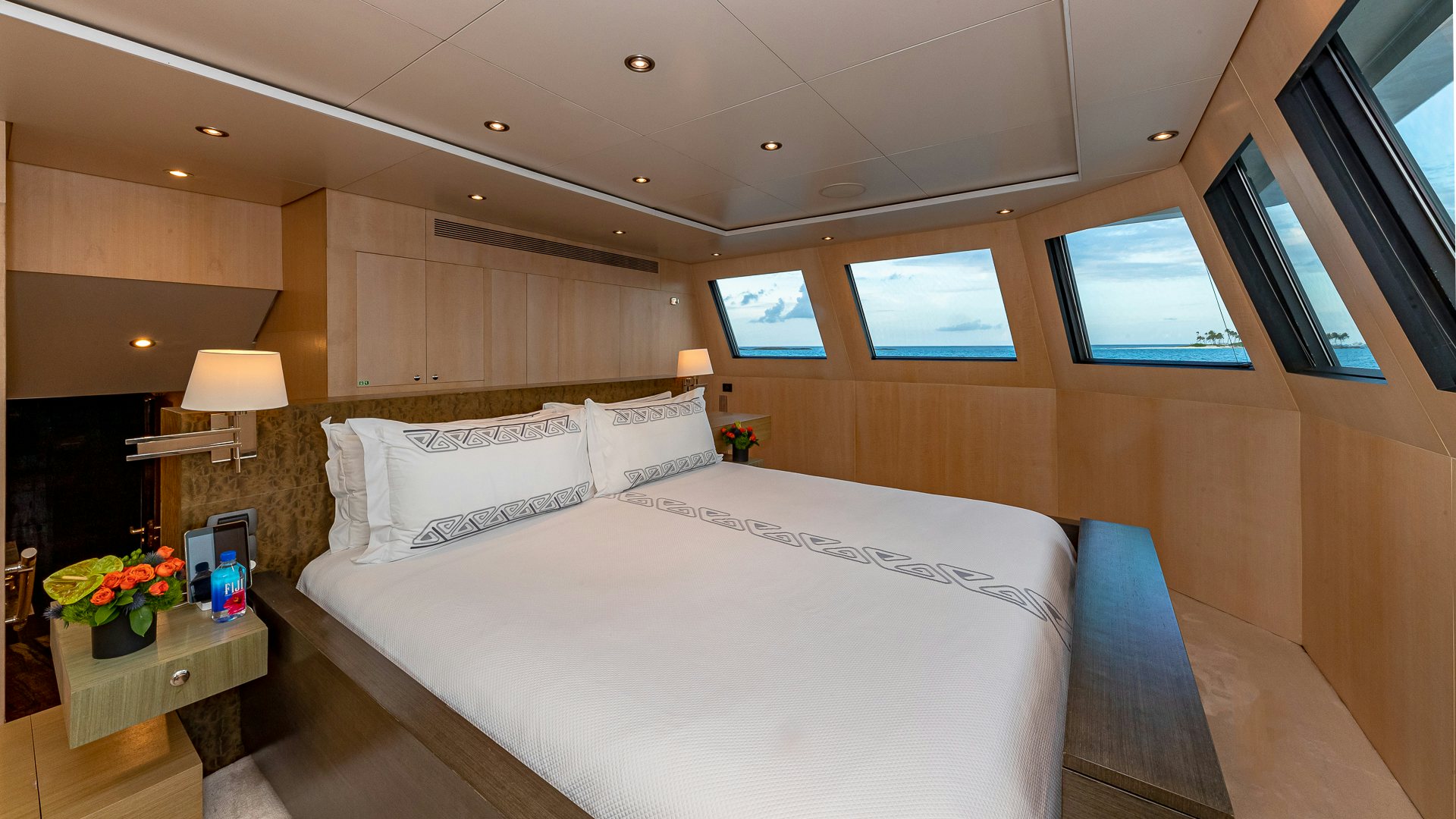 a large bed in a room aboard HIGHLANDER Yacht for Charter