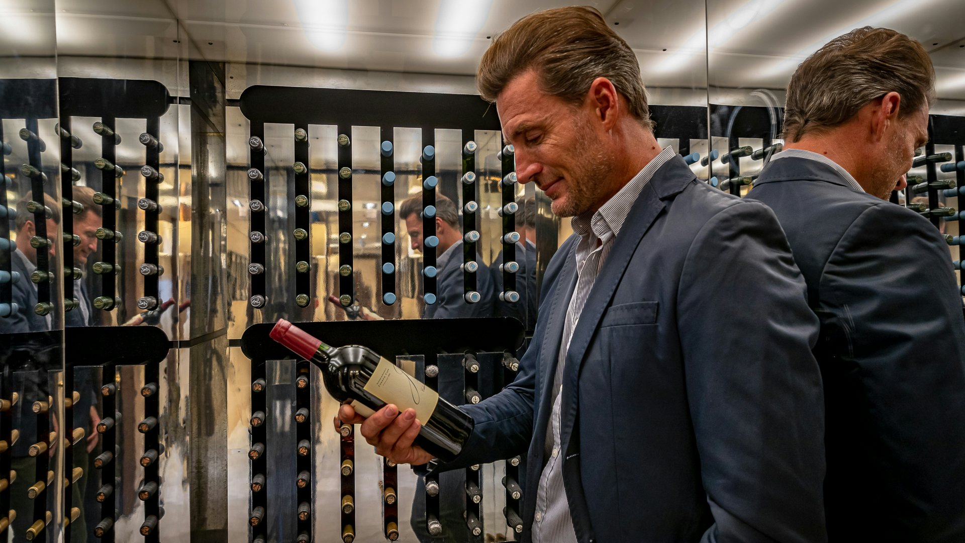 men looking at a machine aboard HIGHLANDER Yacht for Charter
