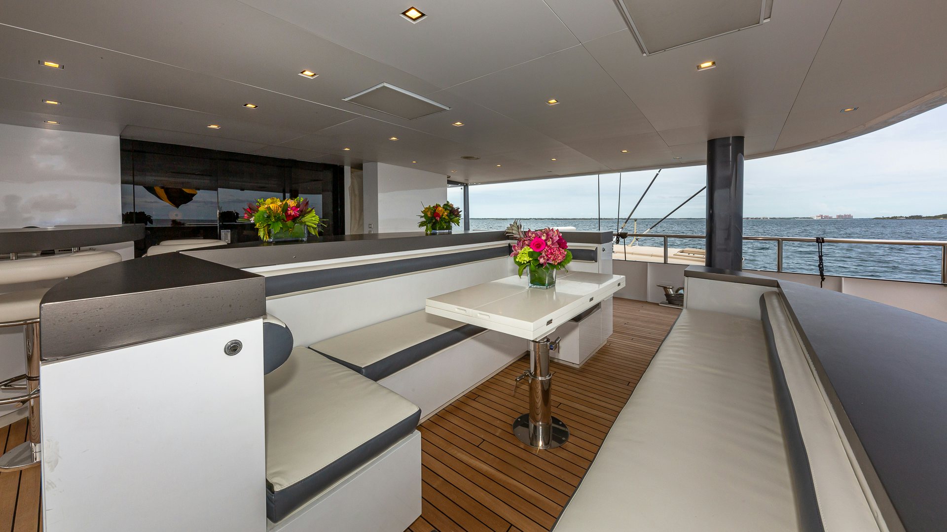 a room with a table and chairs aboard HIGHLANDER Yacht for Charter